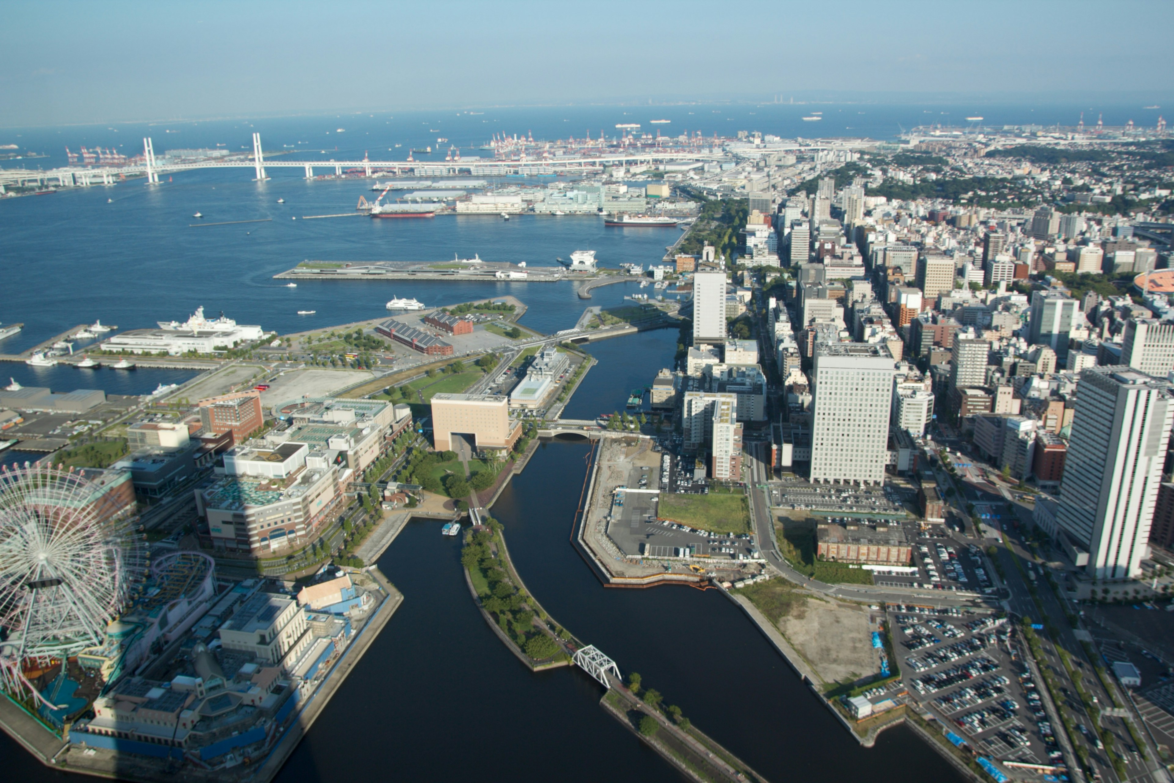 Aerial view of urban landscape featuring high-rise buildings and waterways