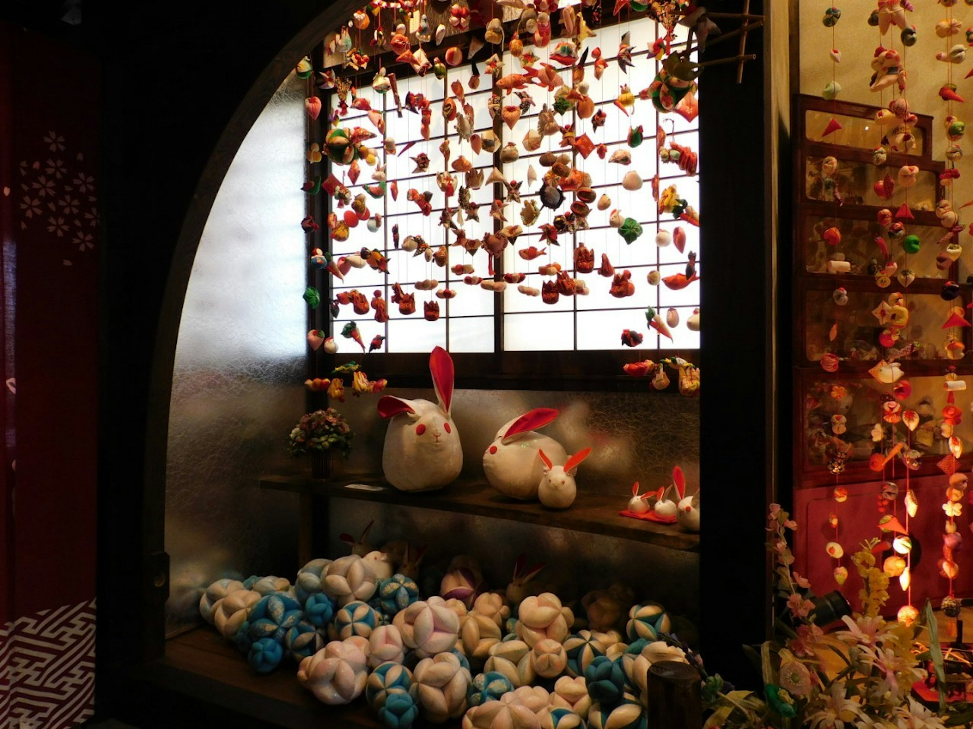 Traditional Japanese display featuring colorful decorations two rabbits and soft balls