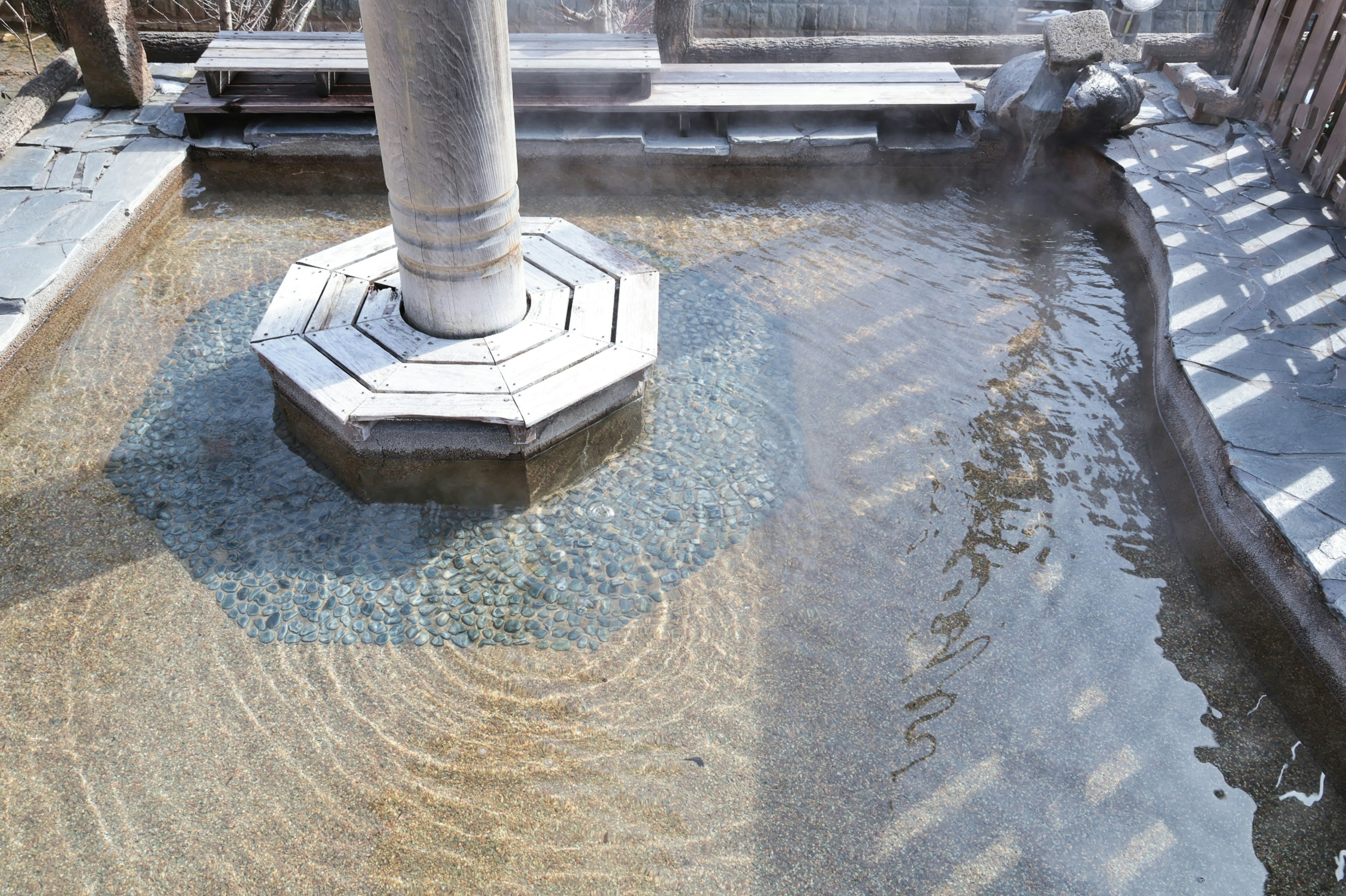 Ripples on the surface of a hot spring with an octagonal pillar