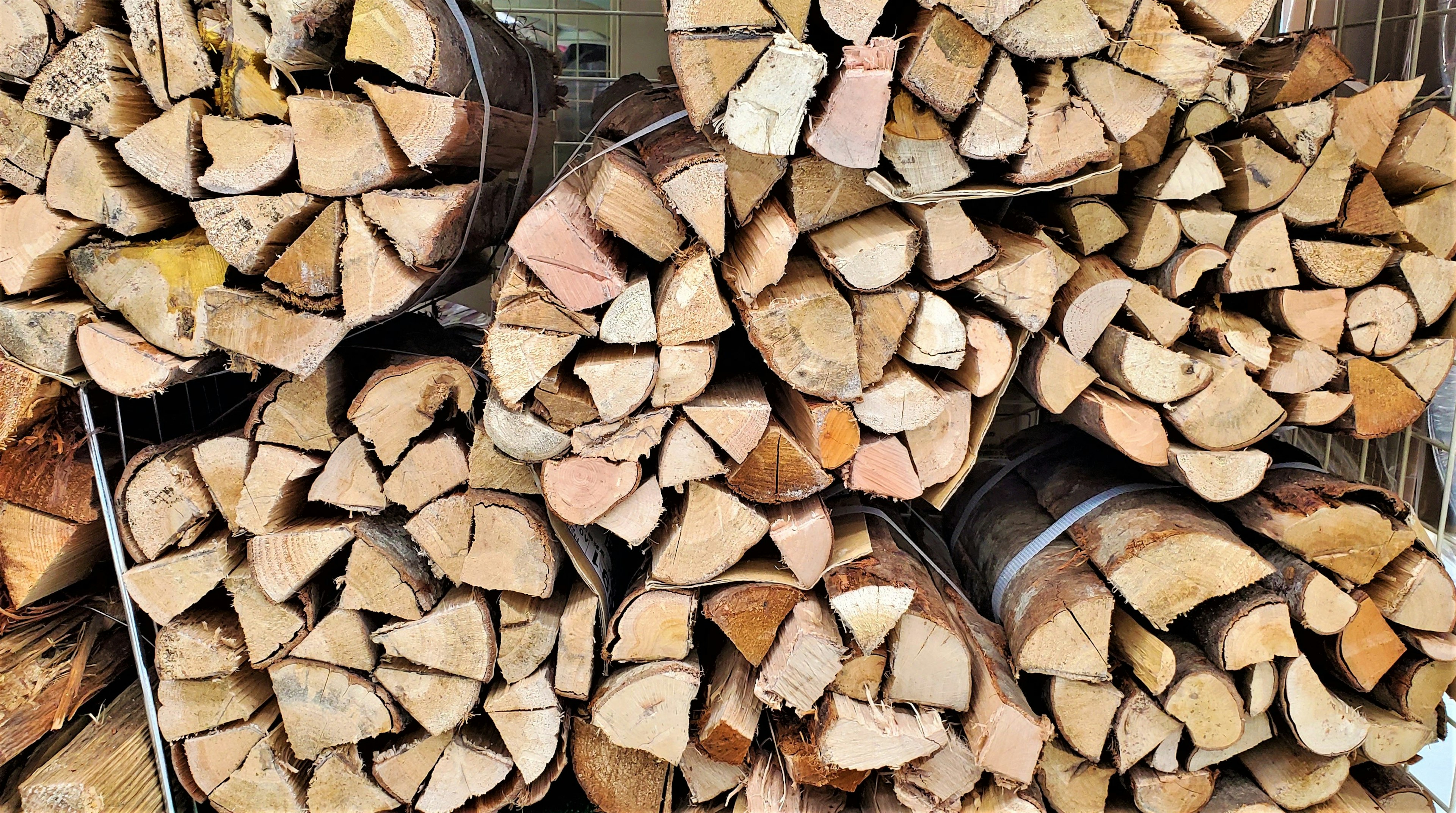 Stacked firewood arranged in a neat pile