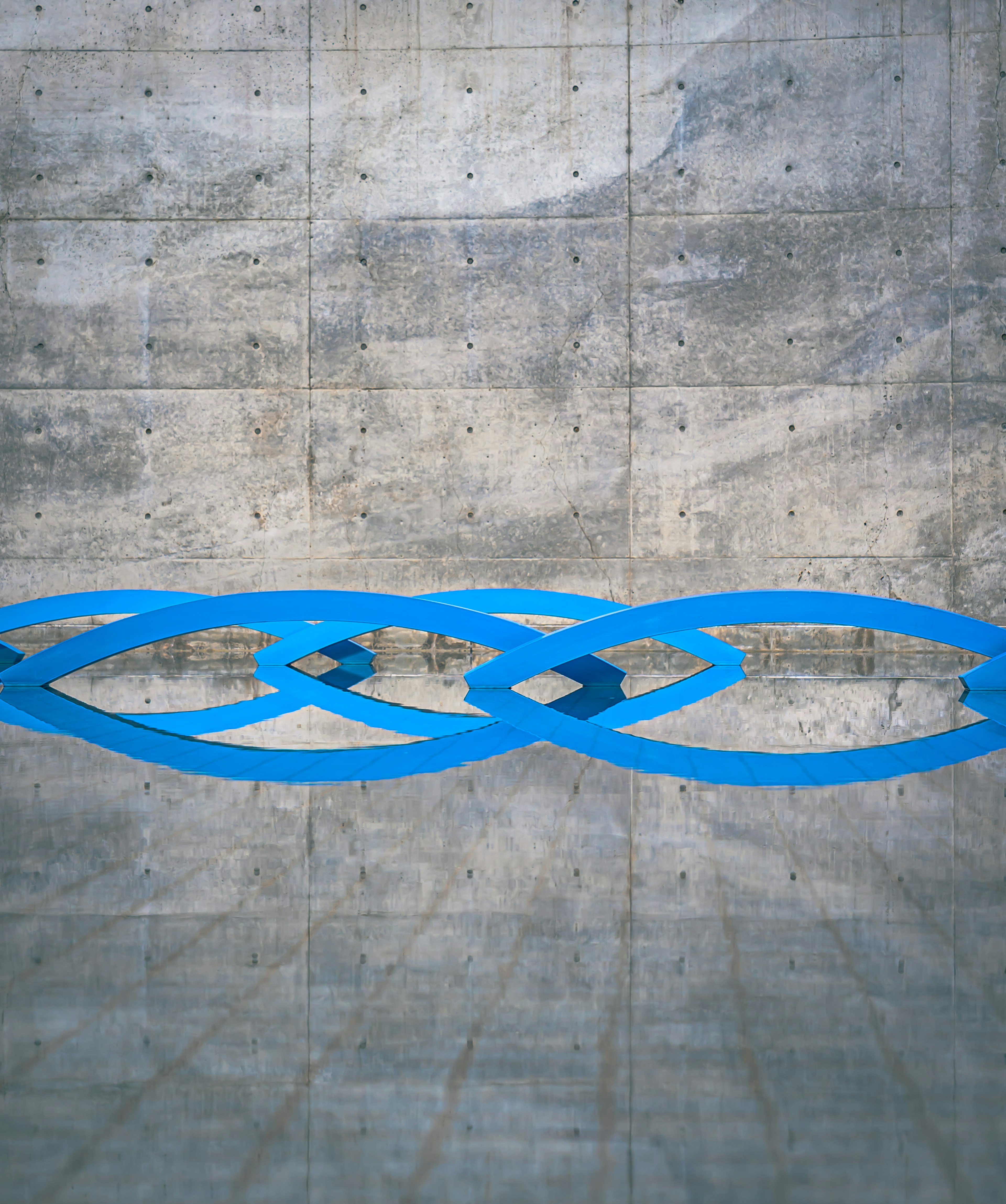 Blue geometric design on a concrete floor