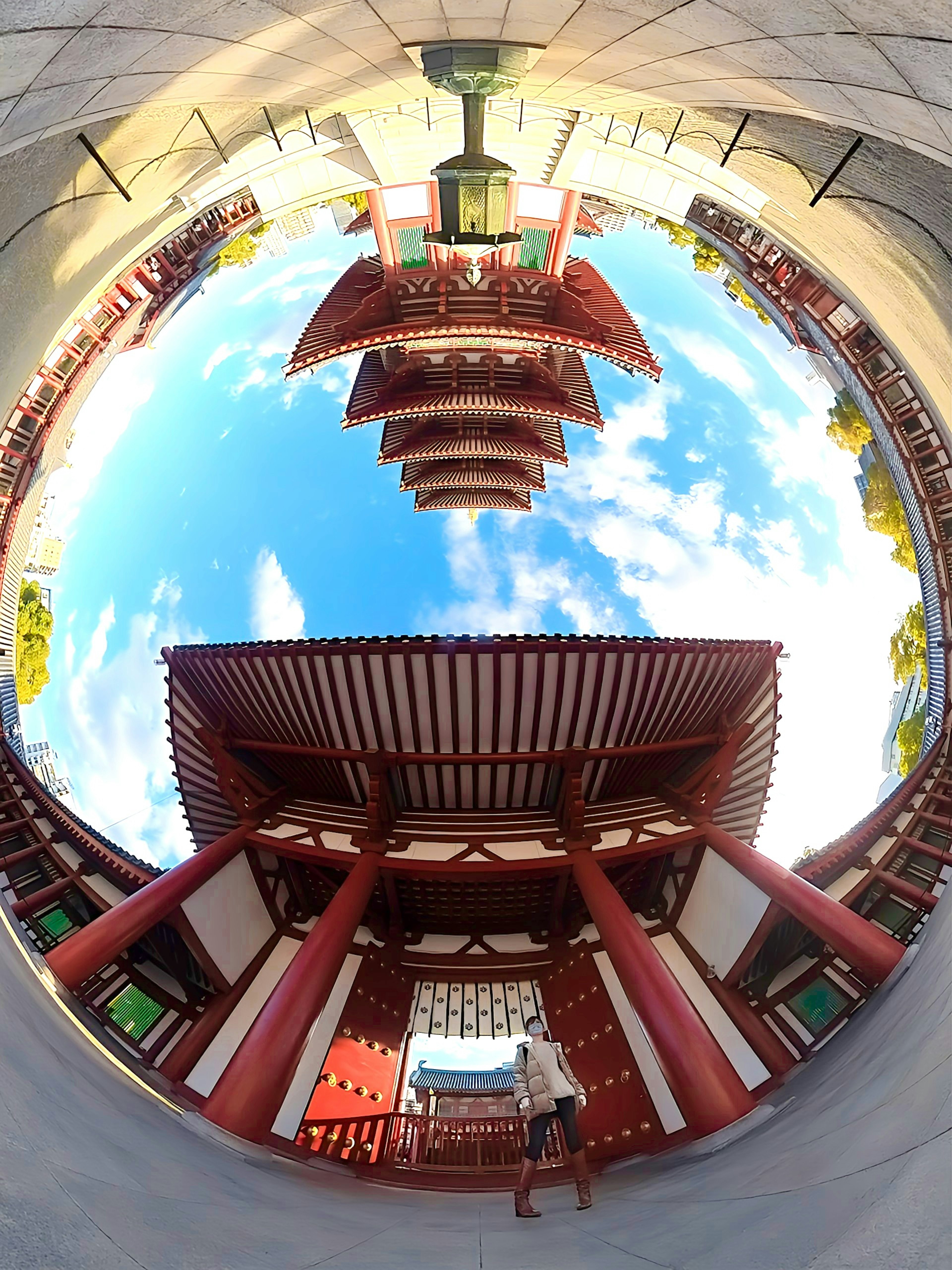 Panoramic view of circular architecture against a blue sky