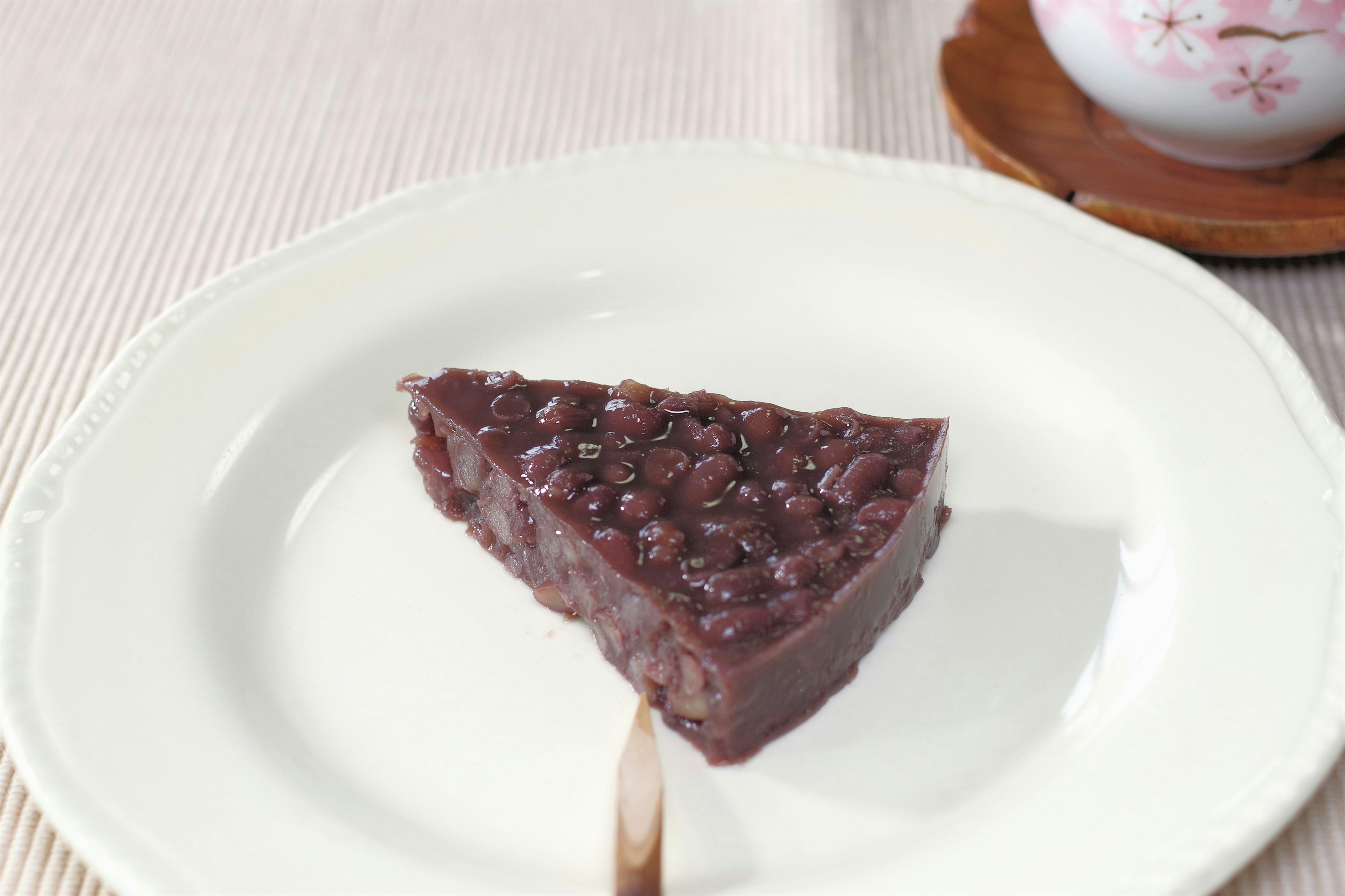 Triangle-shaped red bean cake on a white plate