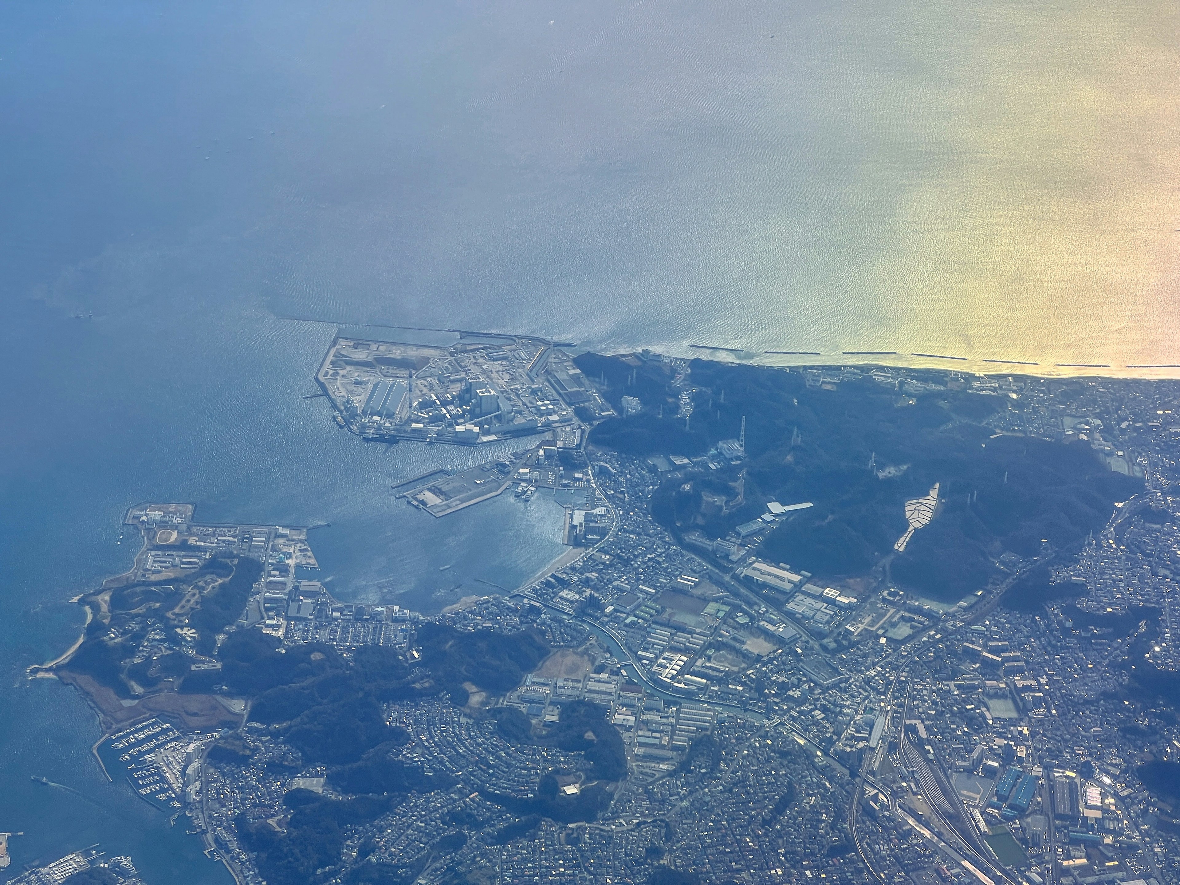 Aerial view of coastline and urban landscape