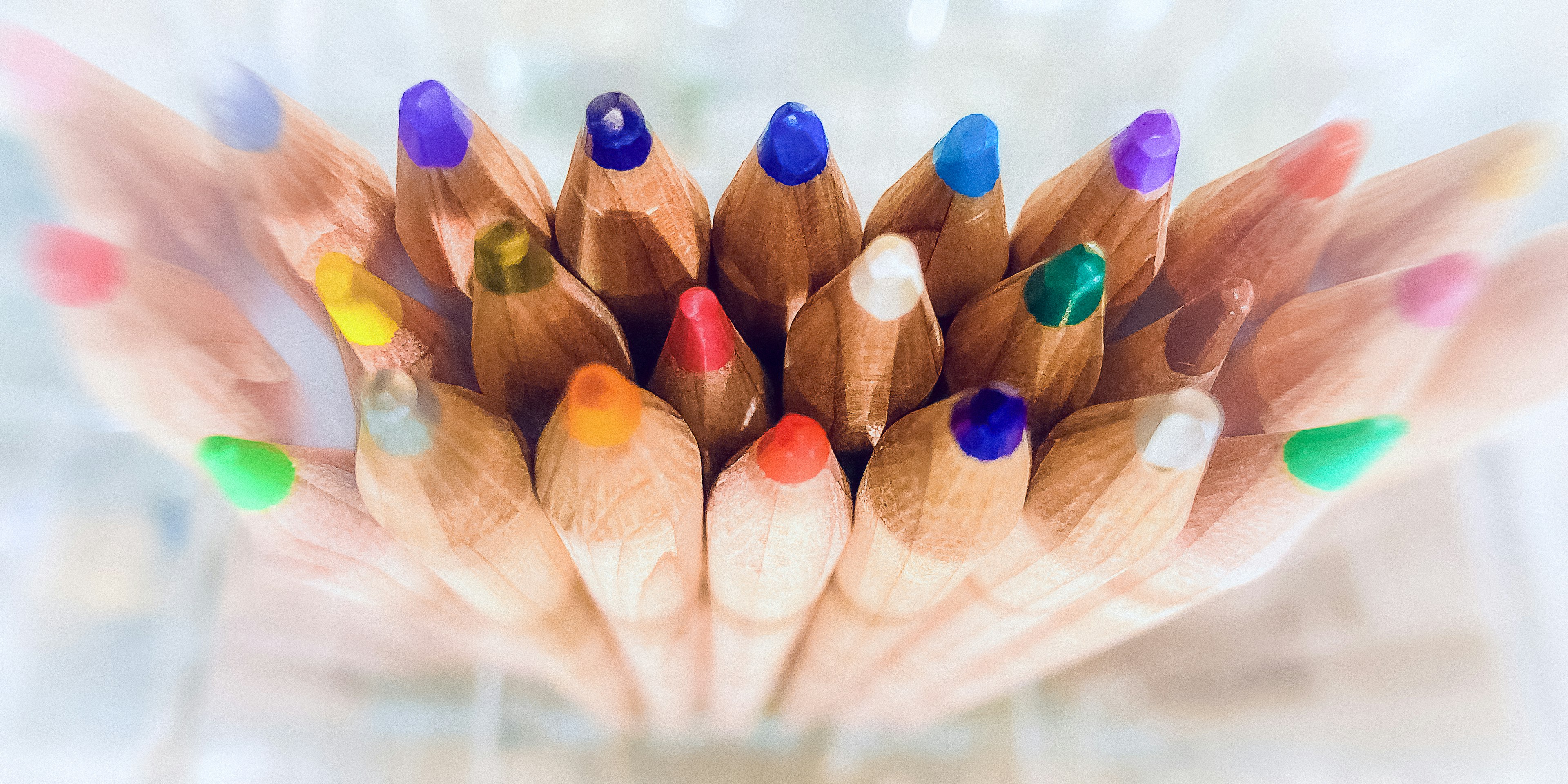 Colorful colored pencils arranged in a circular pattern