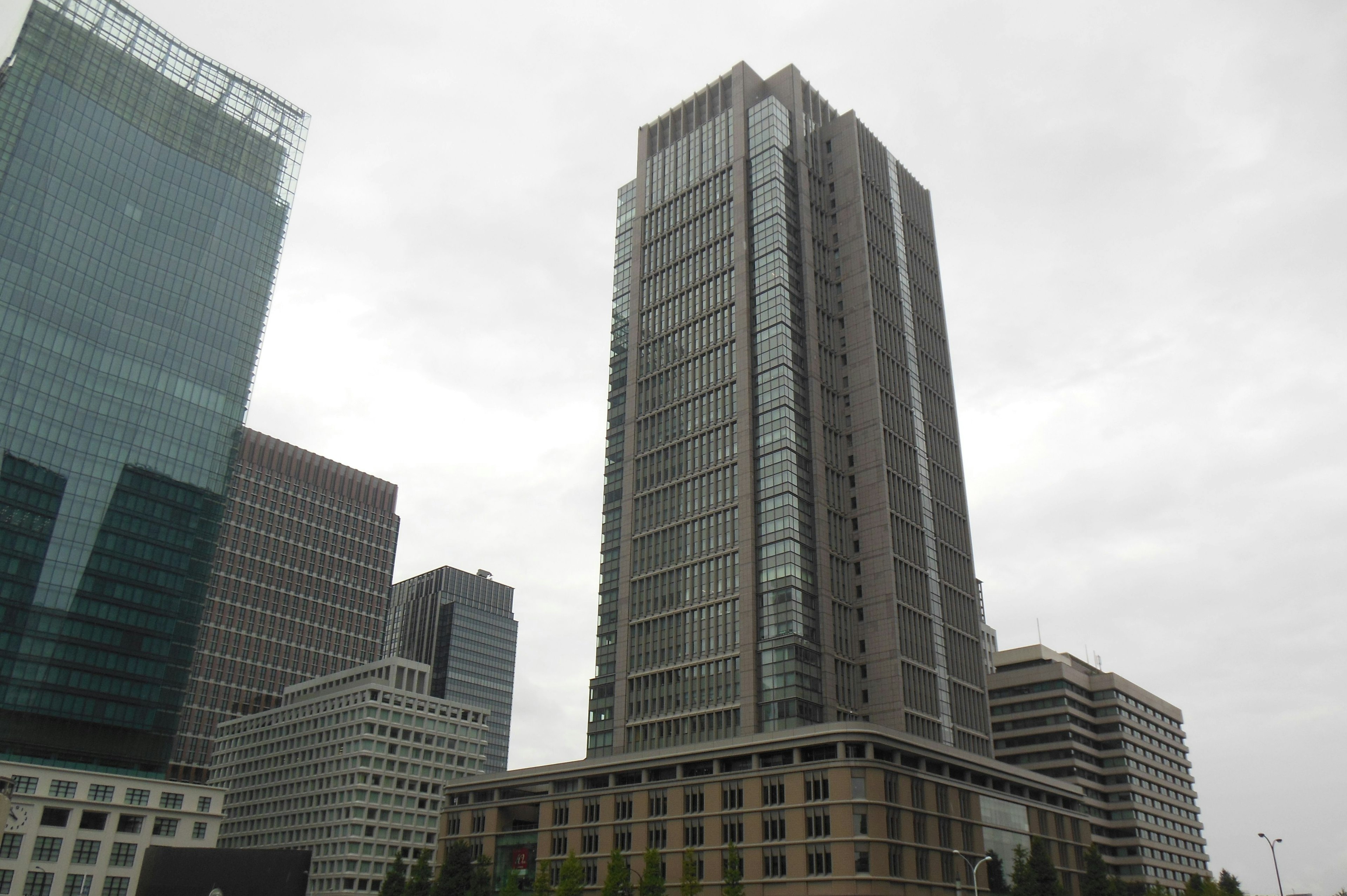 Urban skyline with high-rise buildings under a cloudy sky