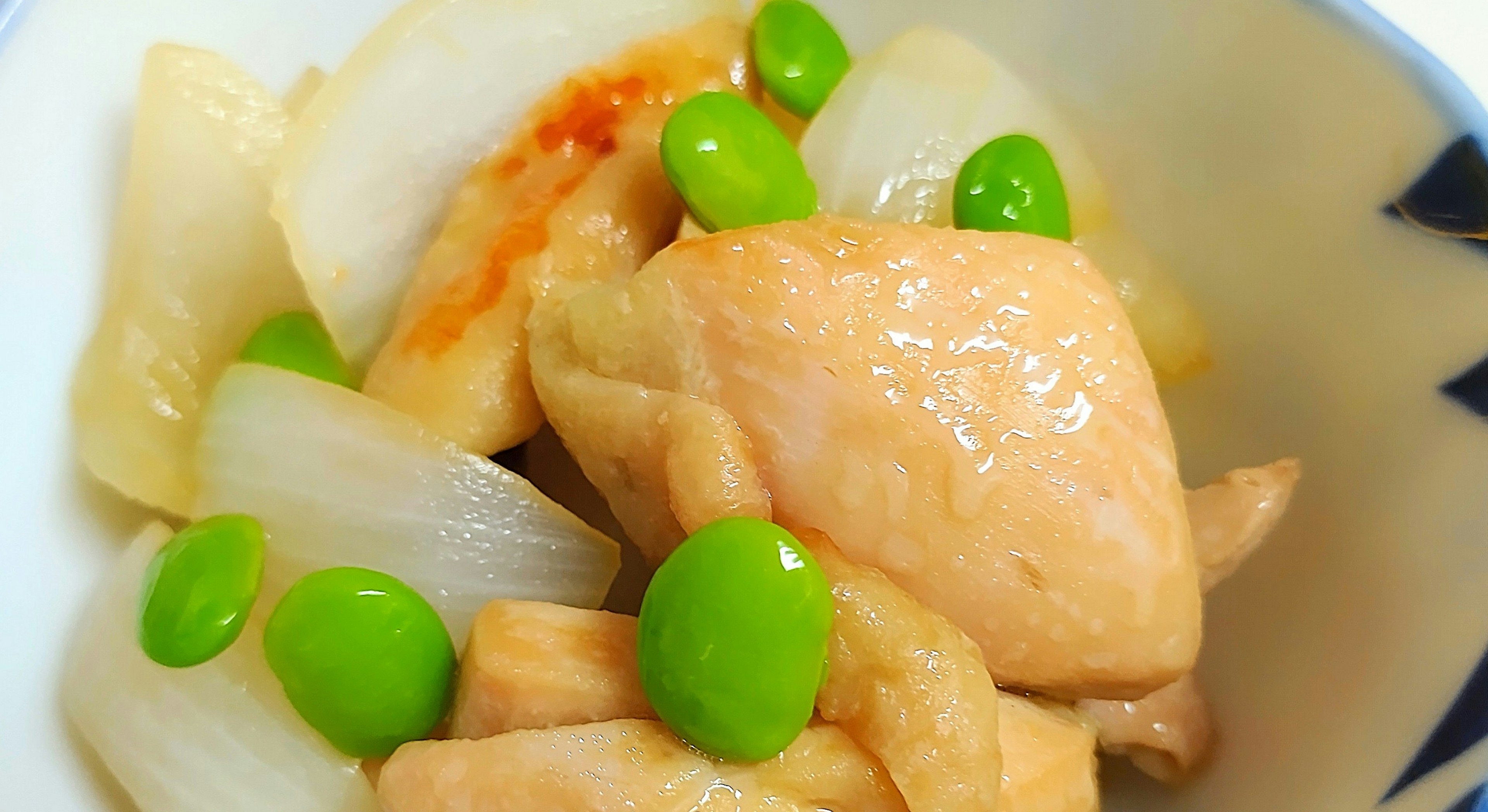 Dish featuring chicken, onion, and green peas