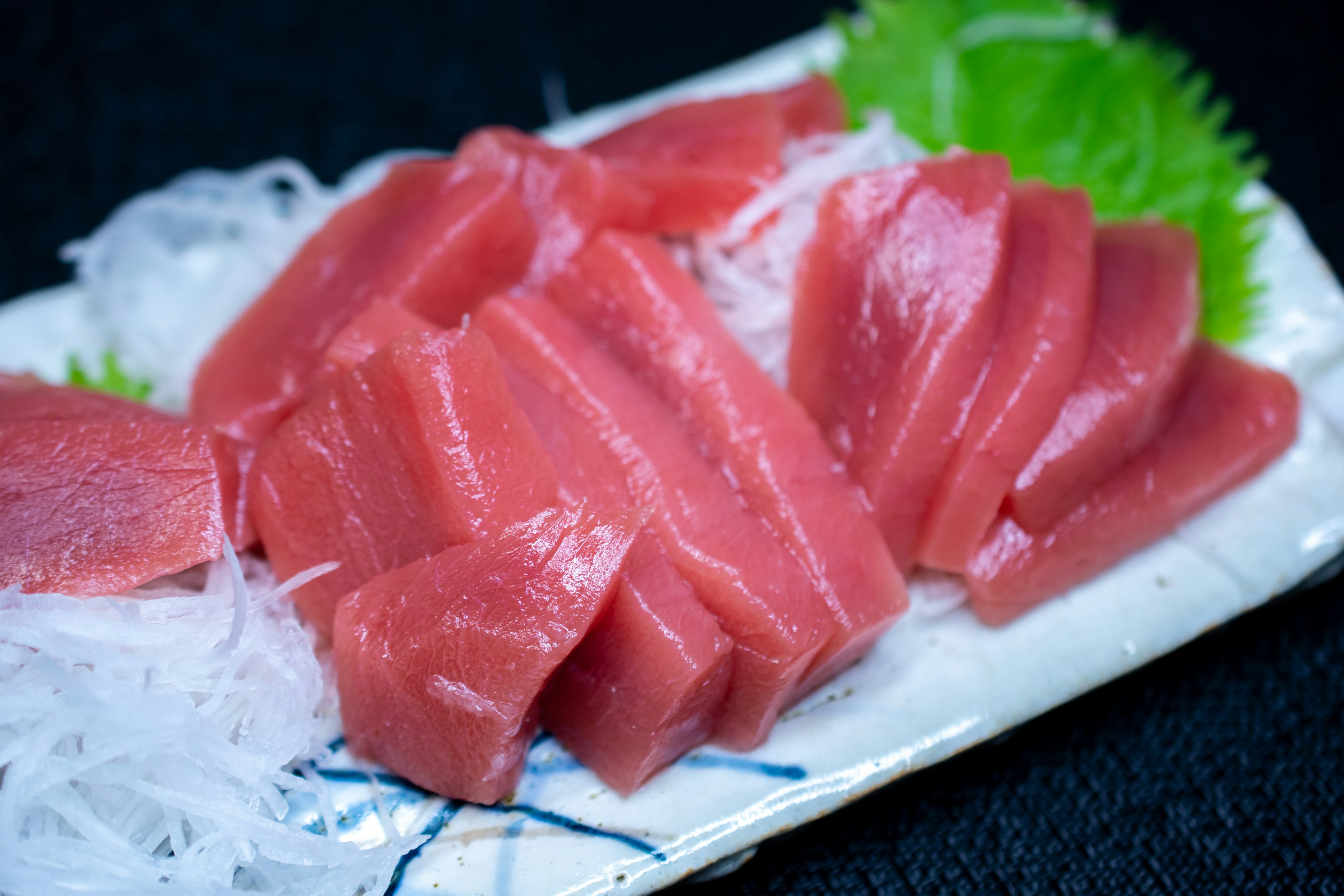 Fresh tuna sashimi arranged on a plate