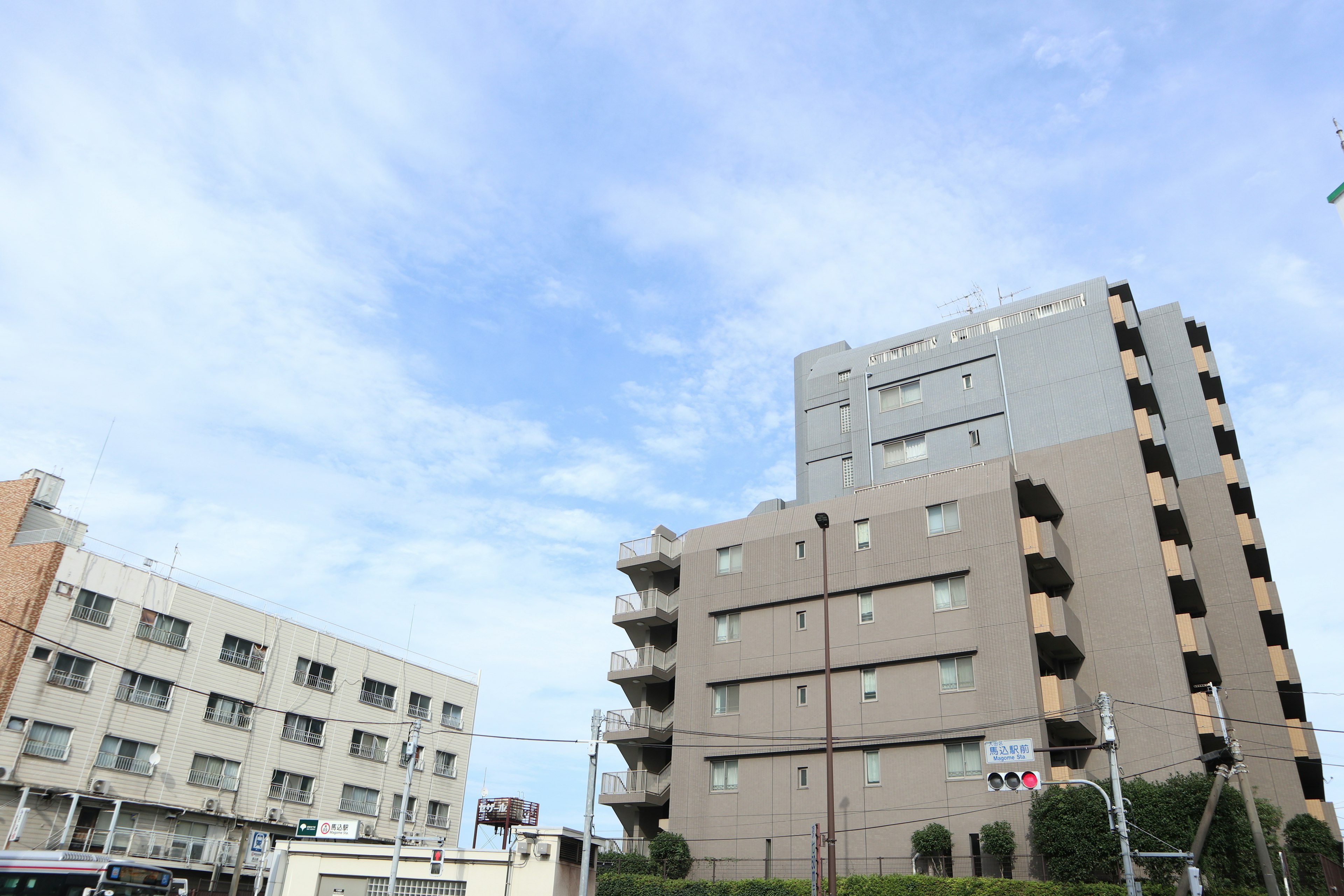 Gray buildings in a cityscape with blue sky