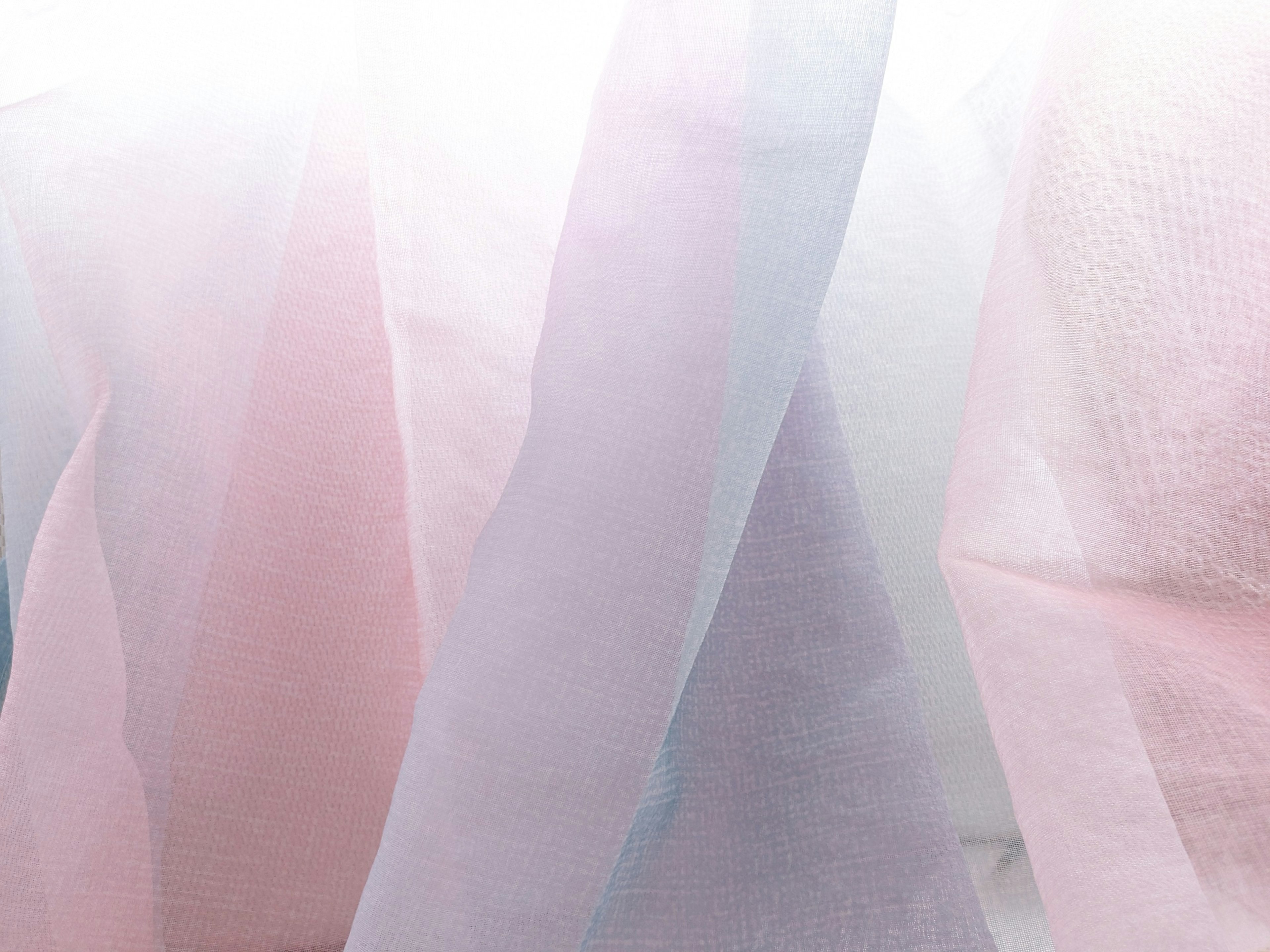 Soft pink and blue chiffon fabric layers overlapping