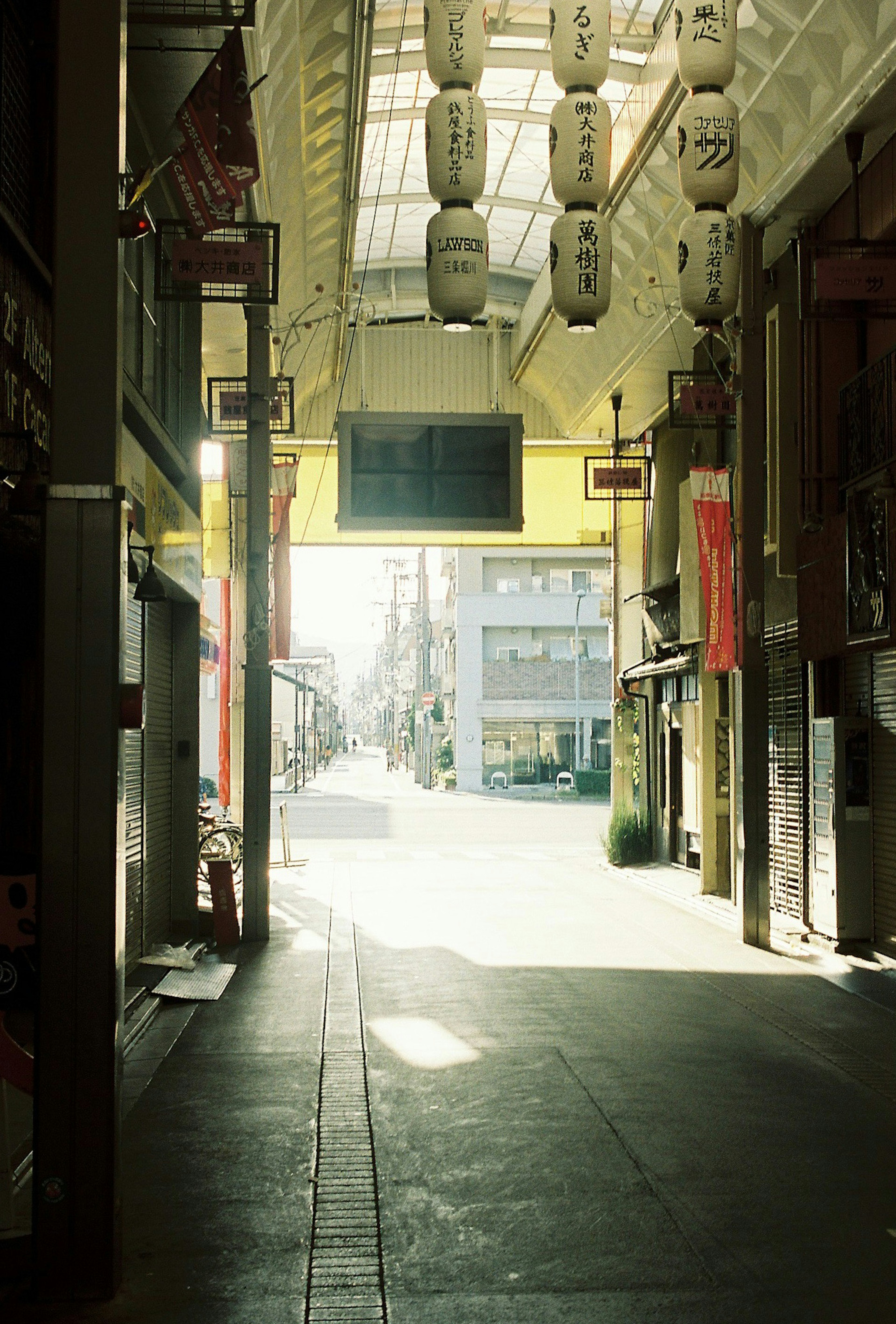 Quiet shopping street with bright light illuminating the pathway