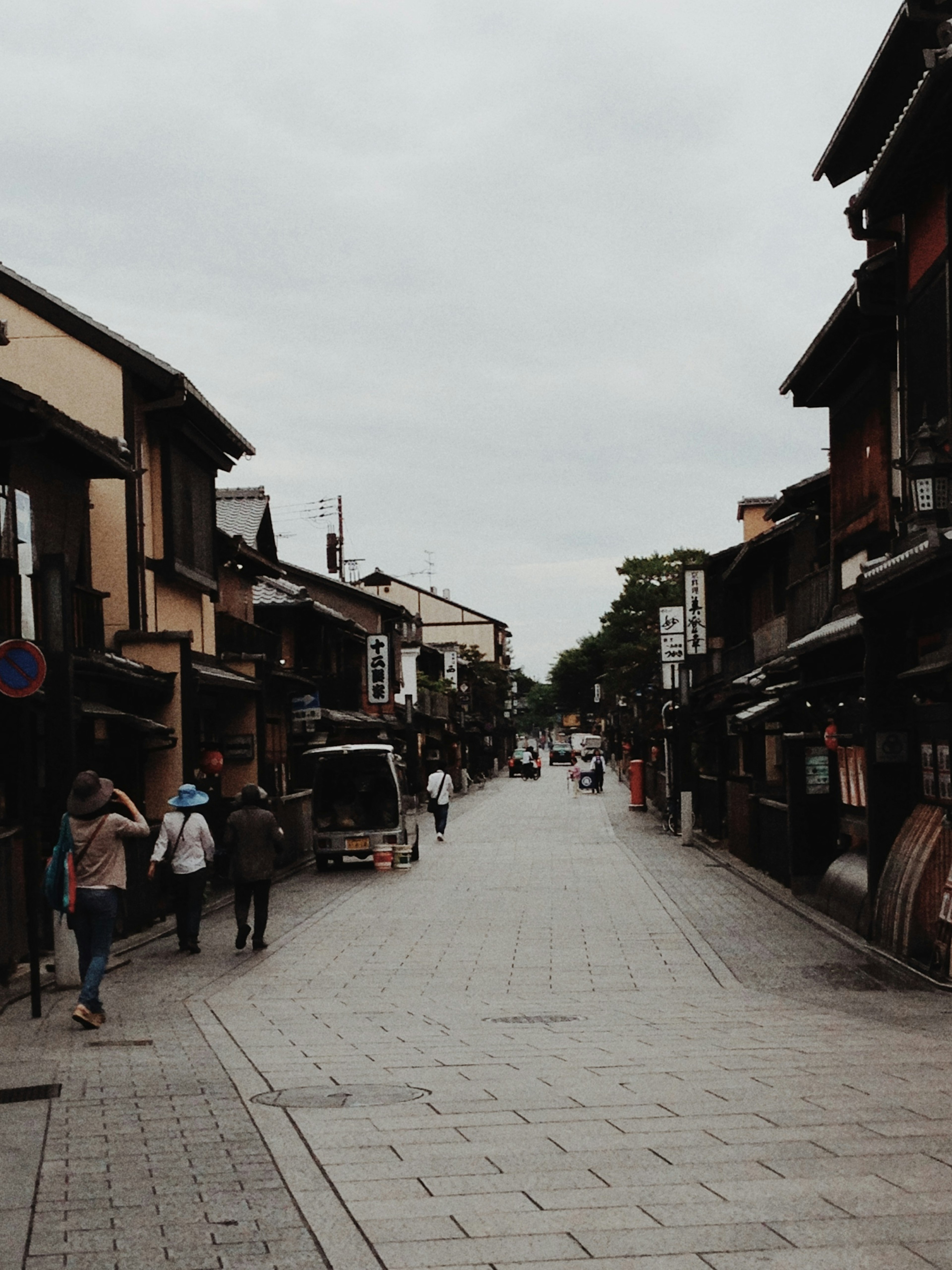 Quiet street lined with traditional Japanese buildings