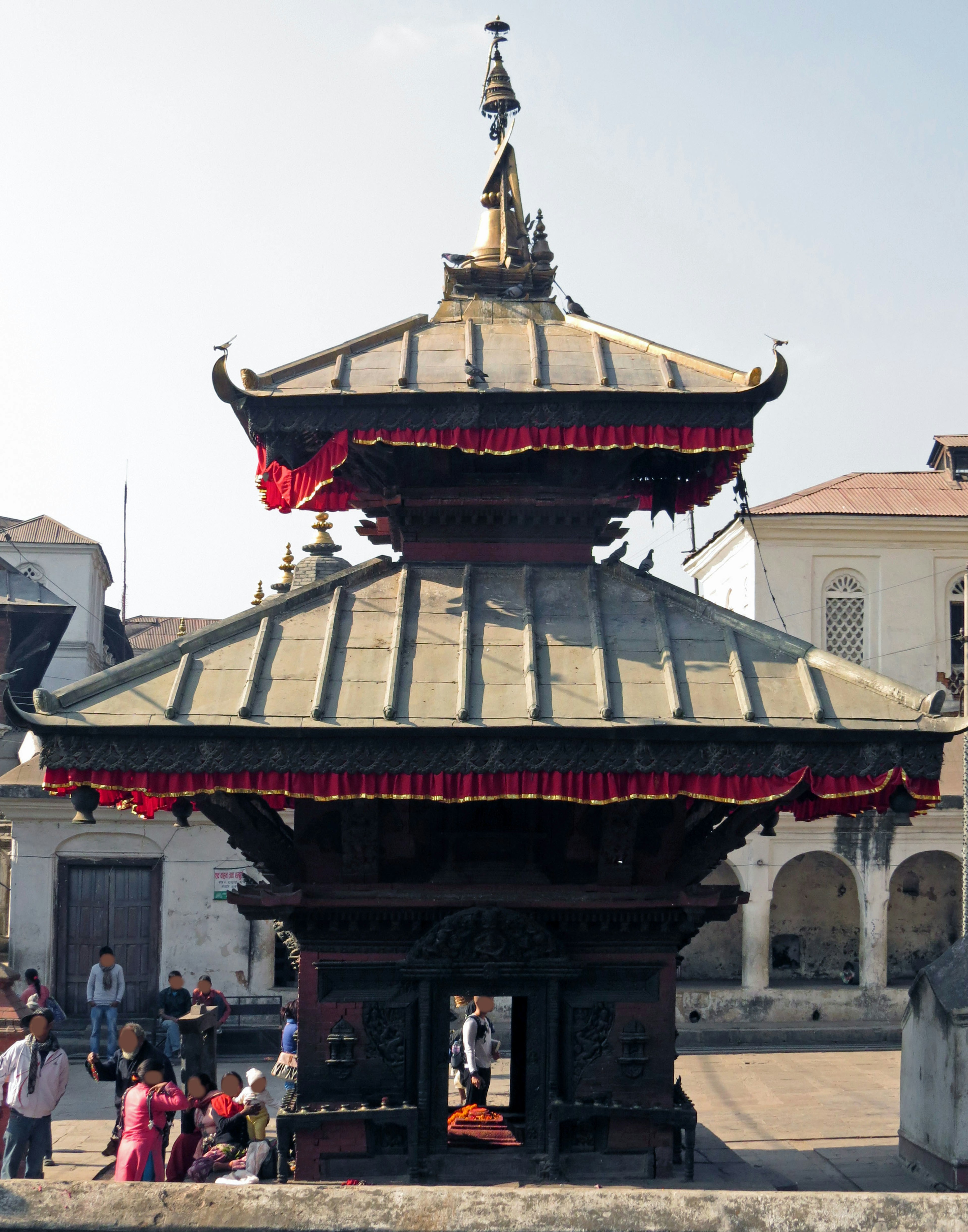 Traditional building with red decorations standing in a plaza