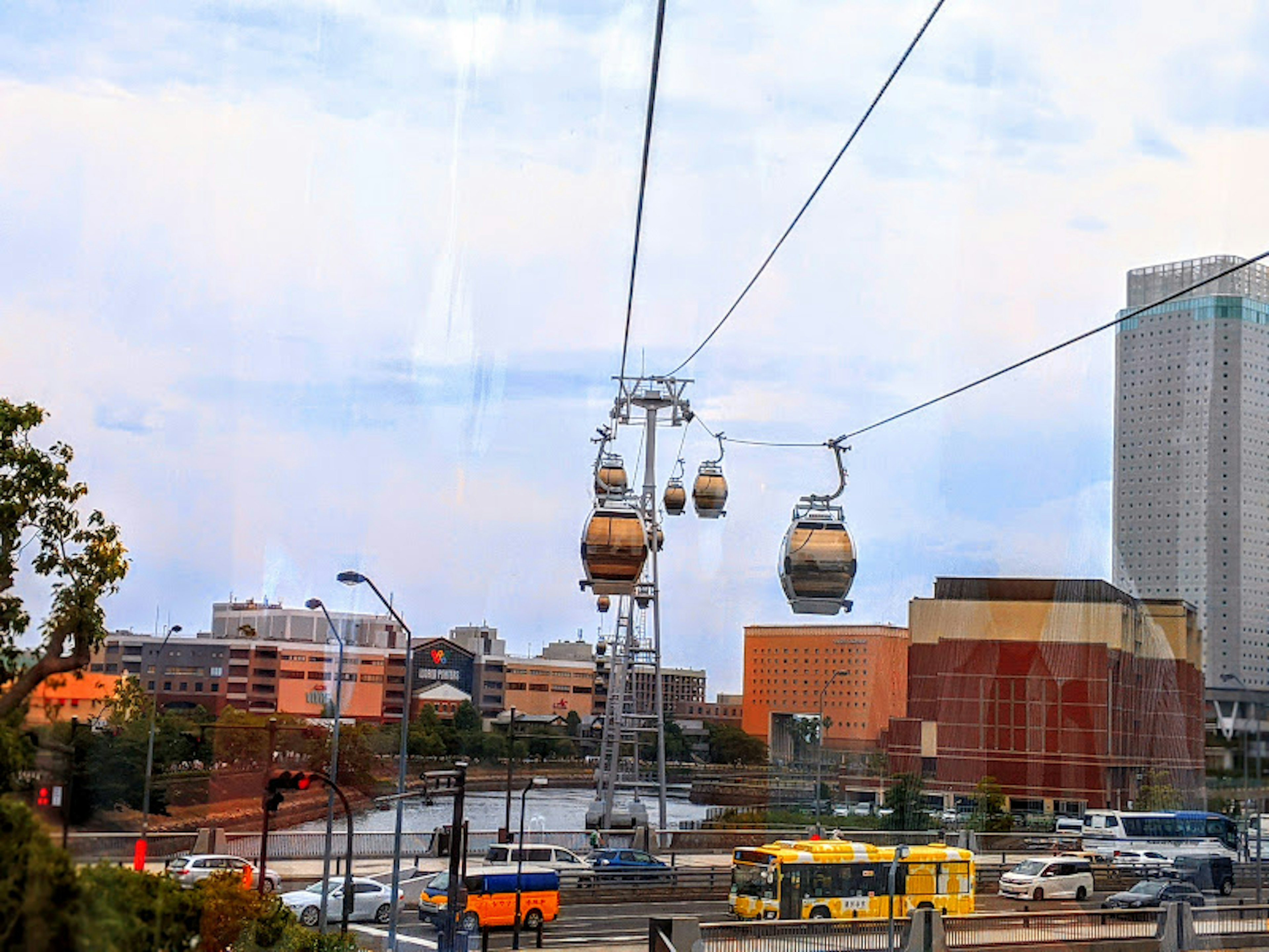 A view of an urban aerial cable car with nearby buildings