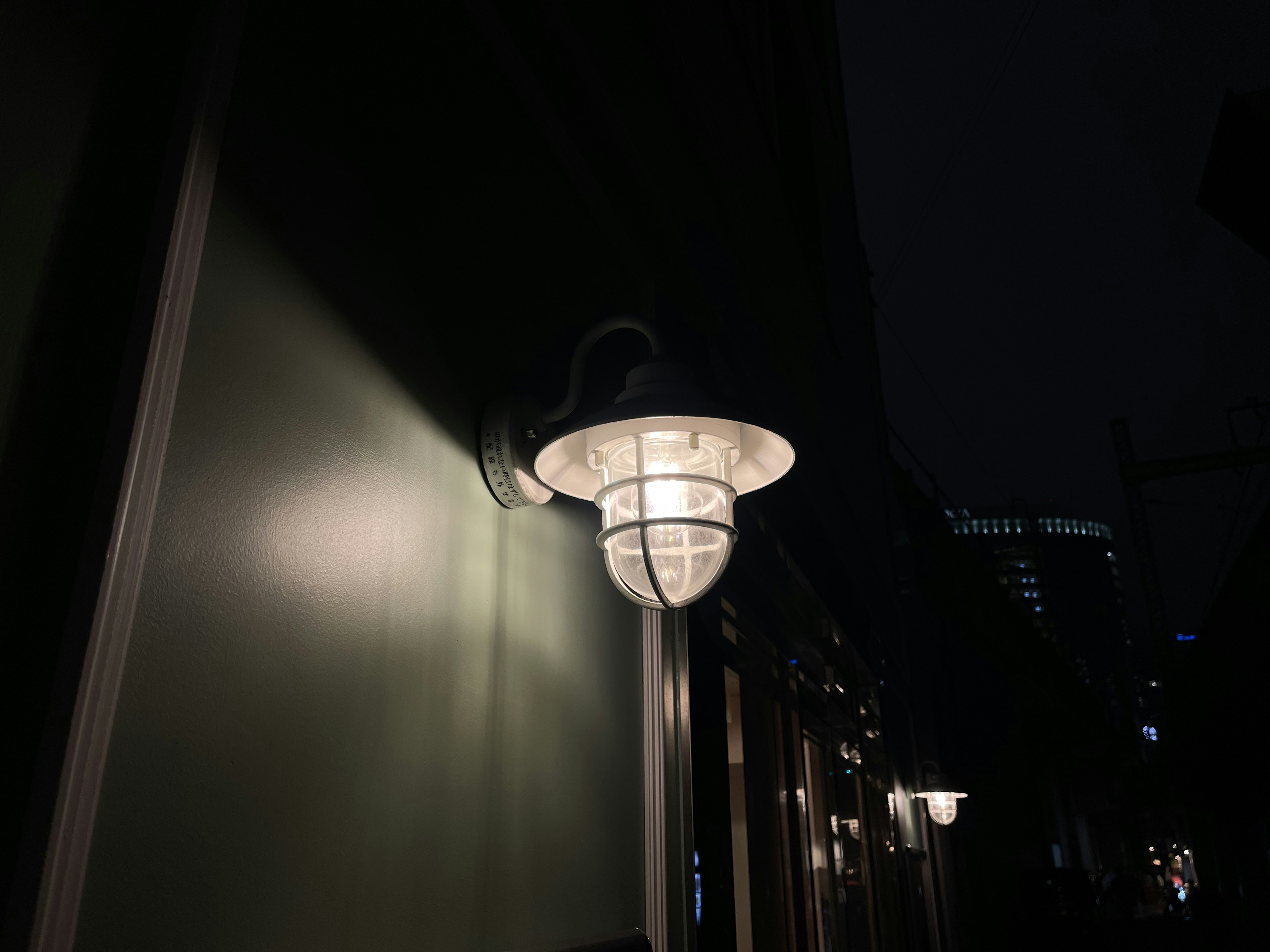 Unique design lamp mounted on a wall at night