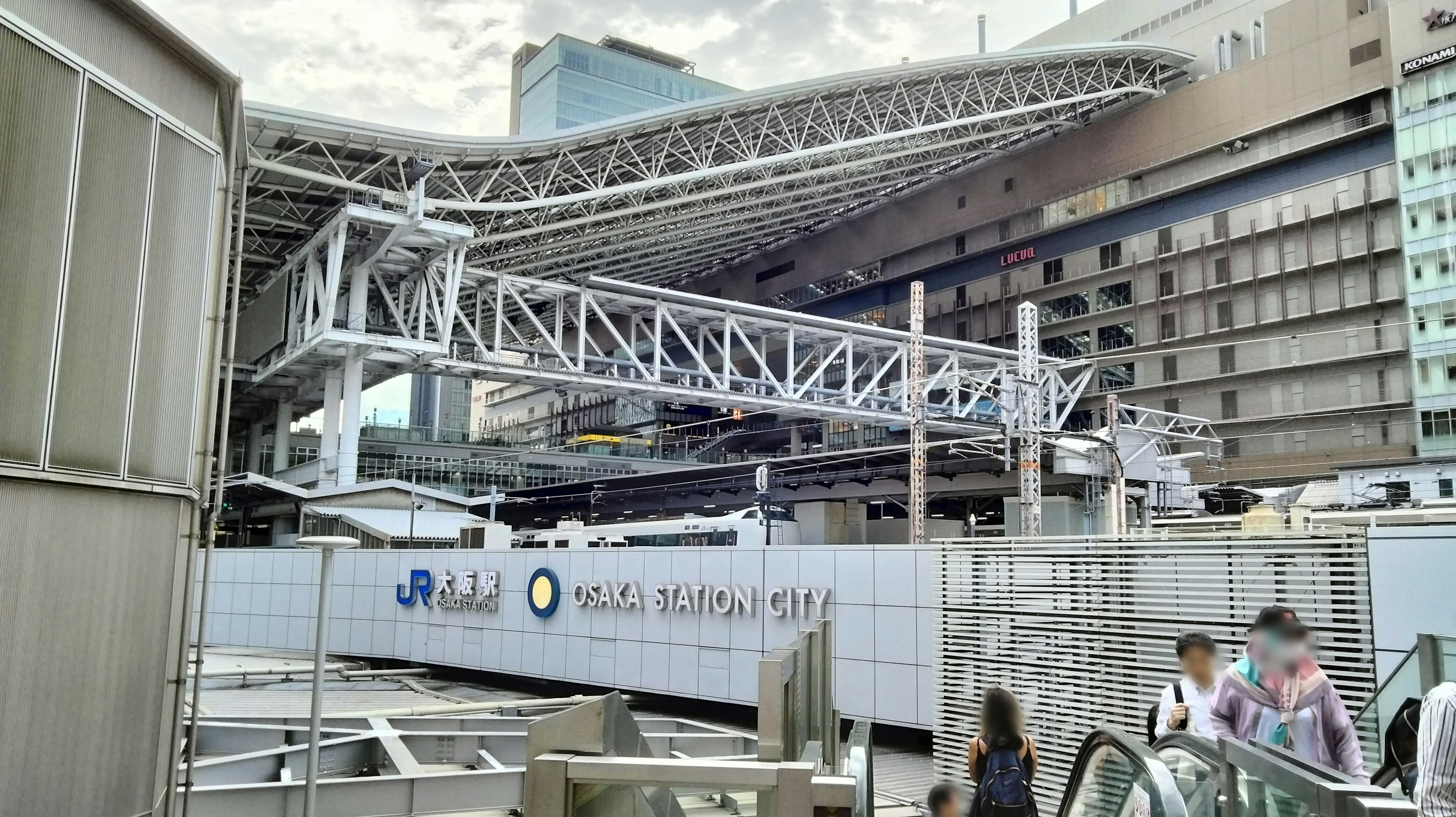 Modern architectural structure of Shinjuku Station with a distinctive roof