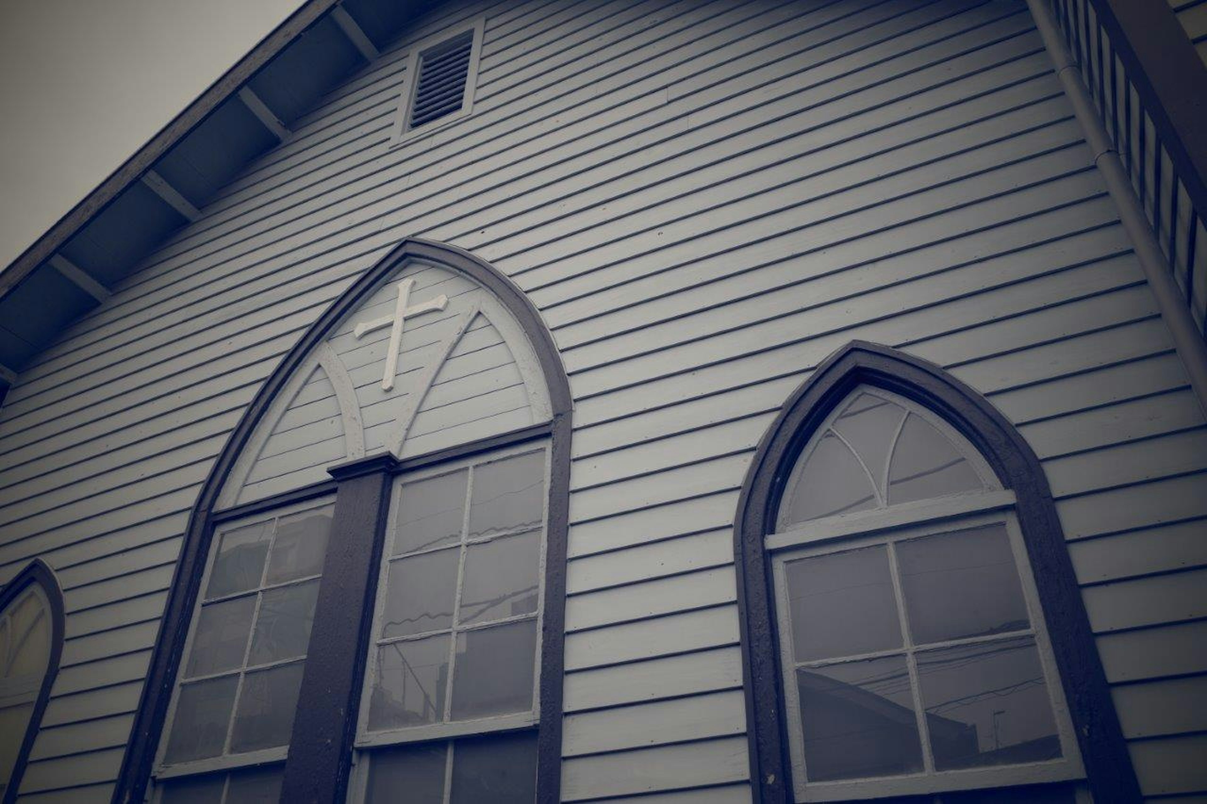 Wooden church exterior with pointed arch windows