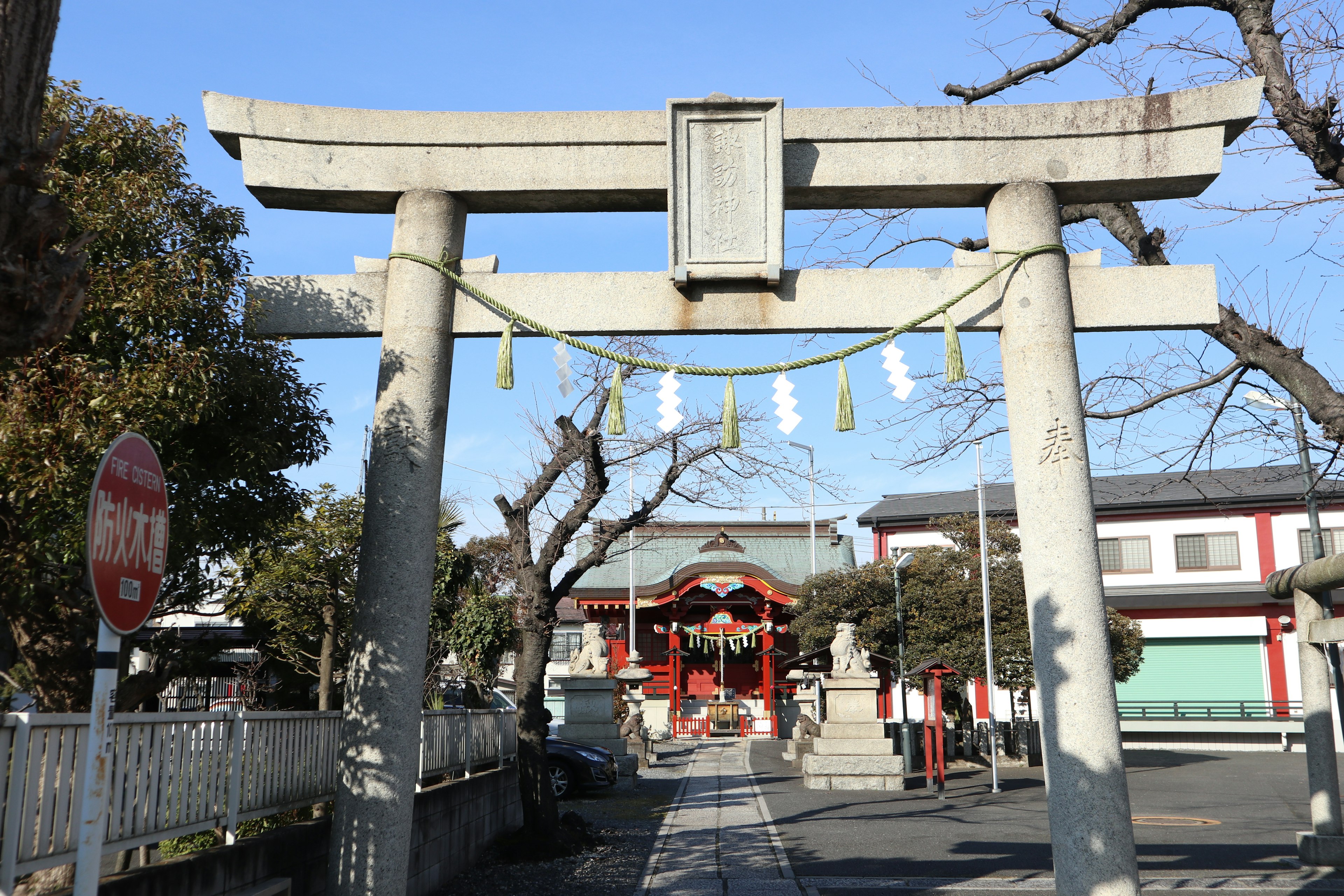 Entrance to a shrine featuring a torii gate