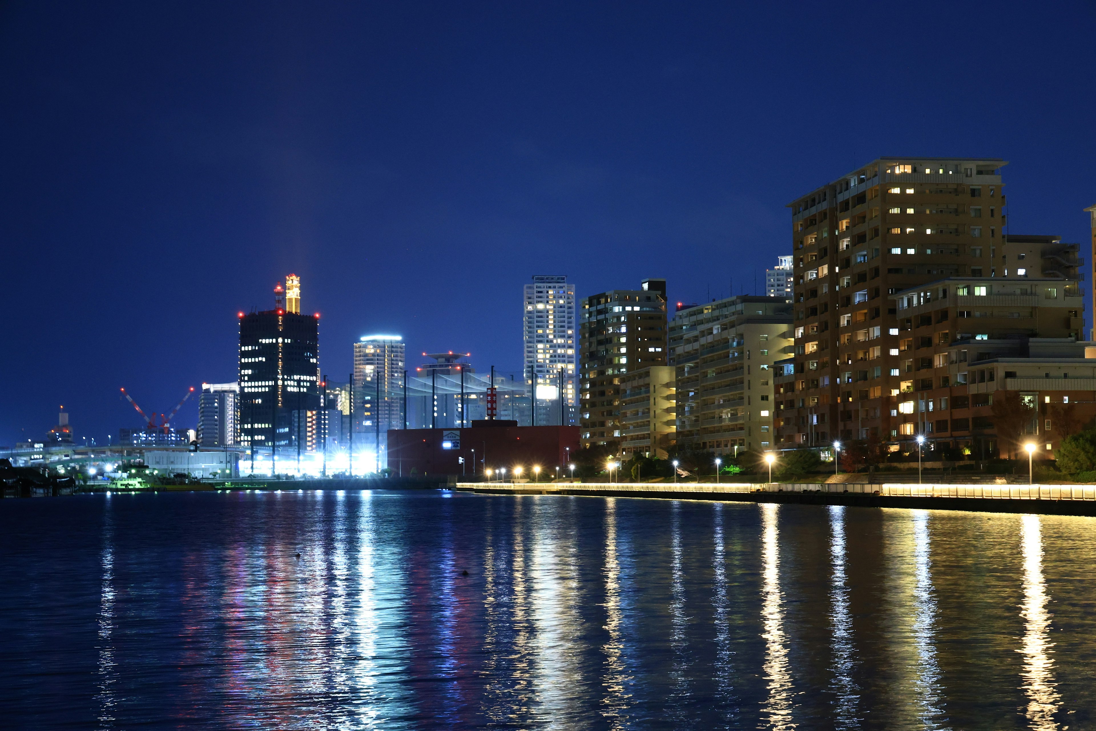 Night cityscape with beautiful waterfront reflections