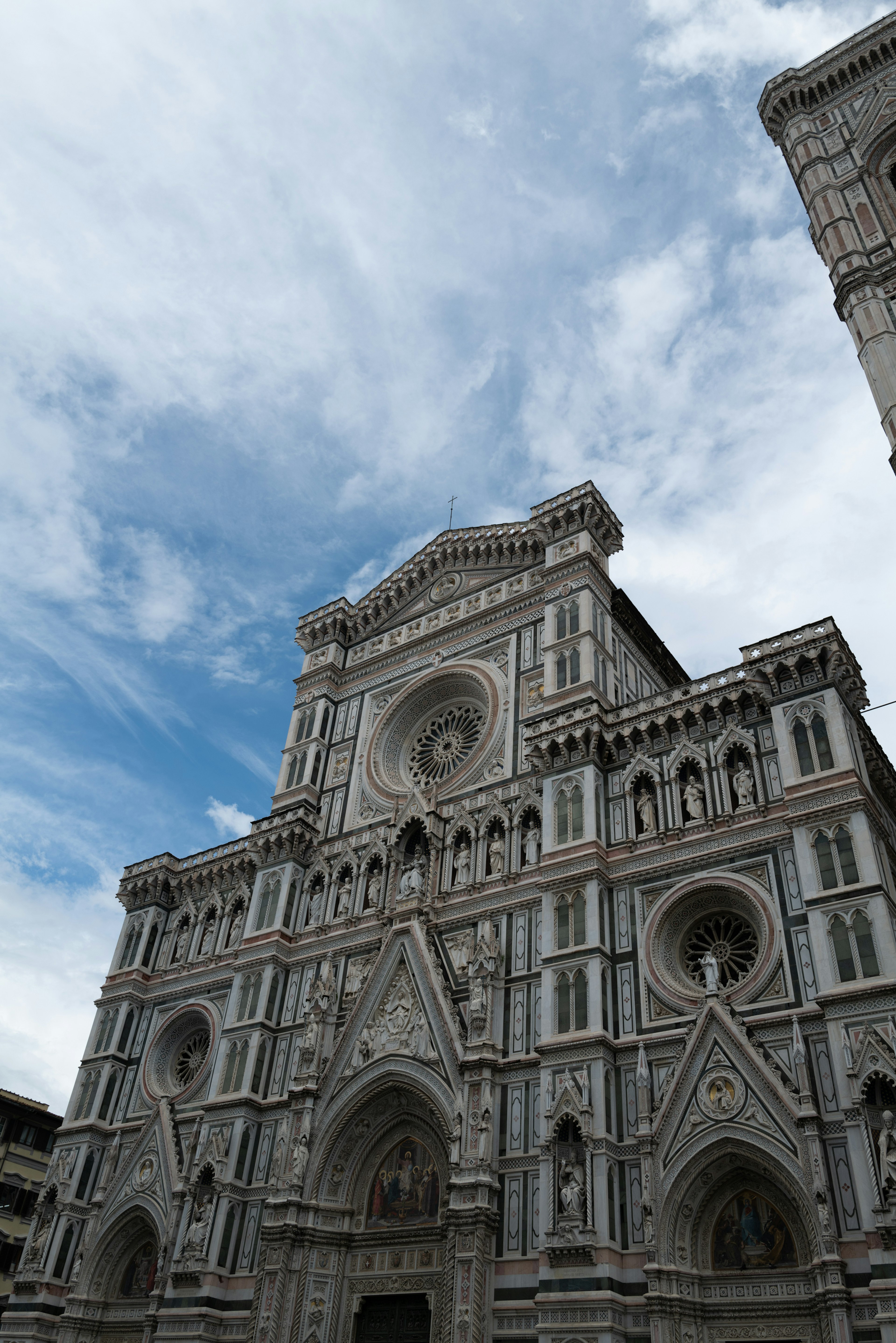 The magnificent facade of Florence Cathedral with blue sky