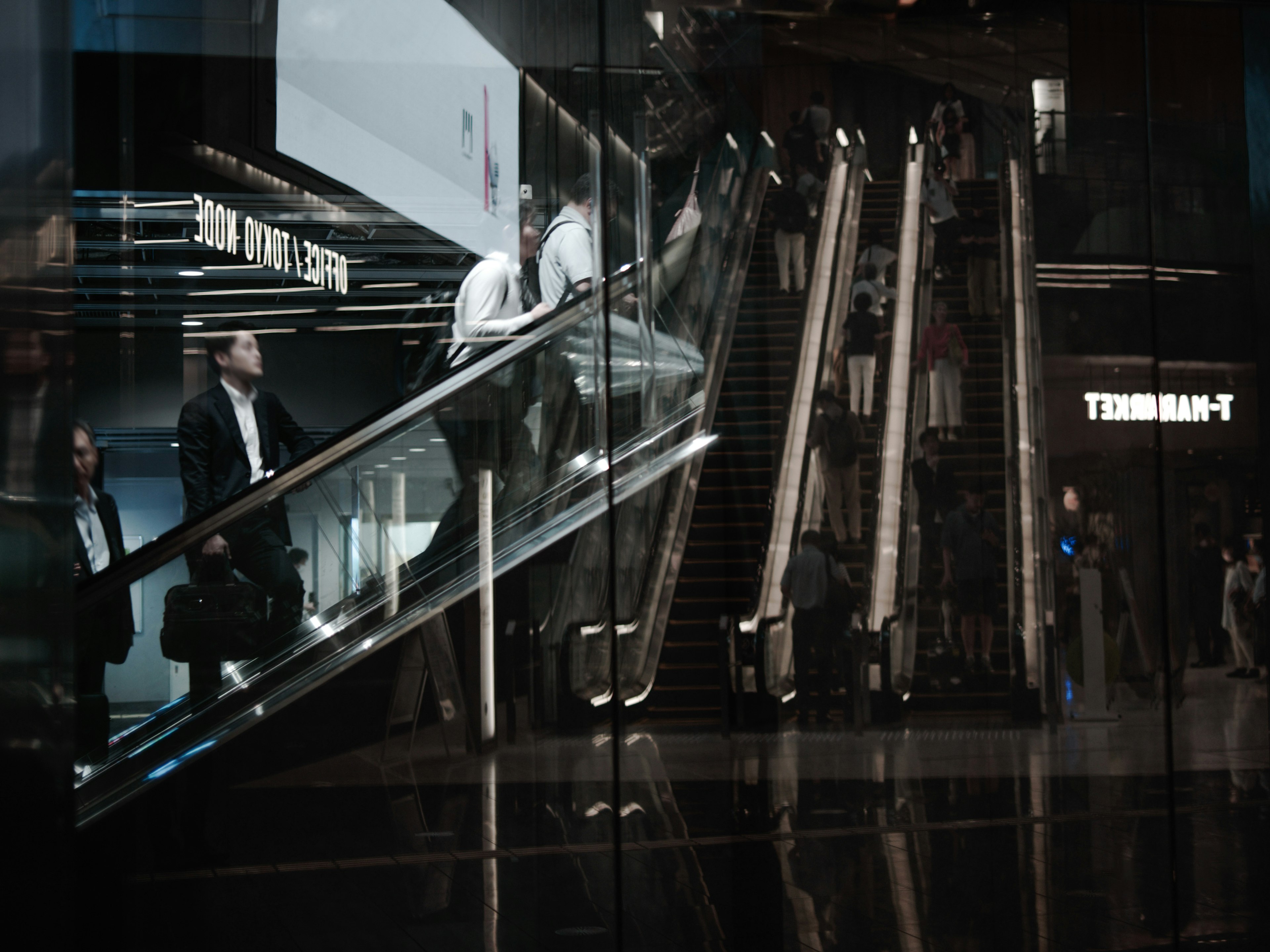 Image of business area with businessmen using escalator reflections