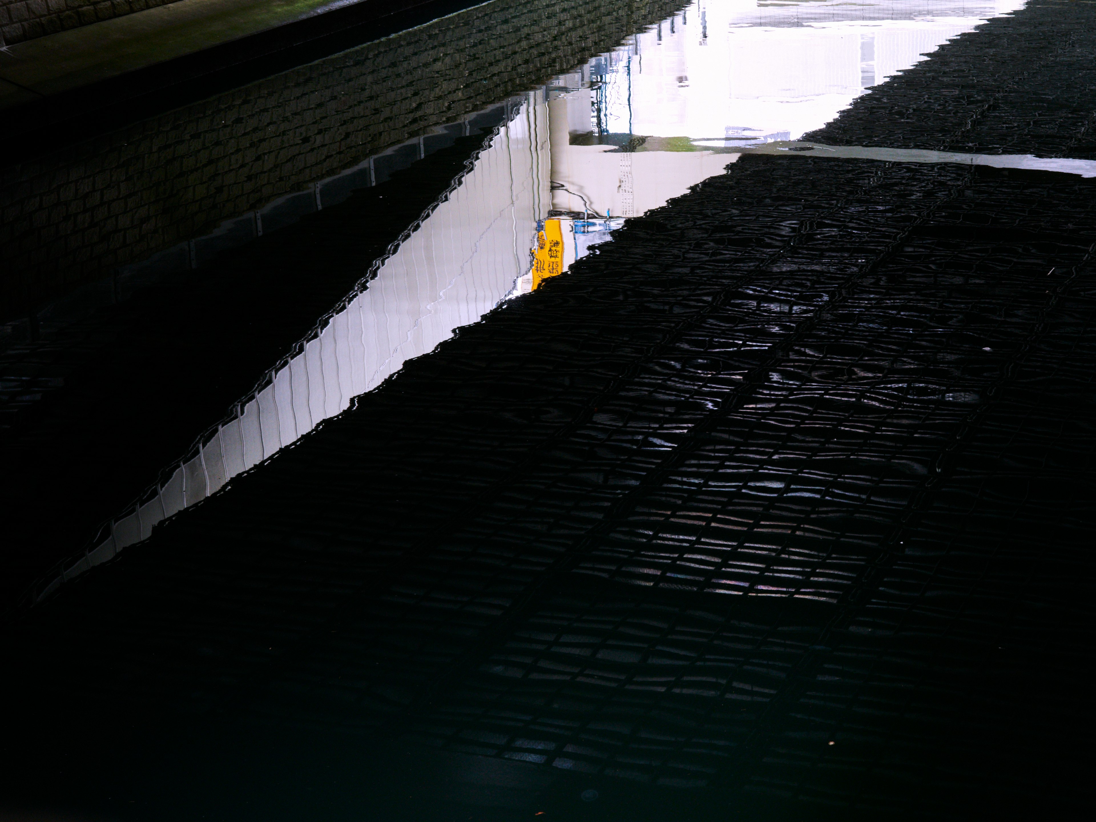 Image showing a black mesh-patterned floor with a bright surrounding environment