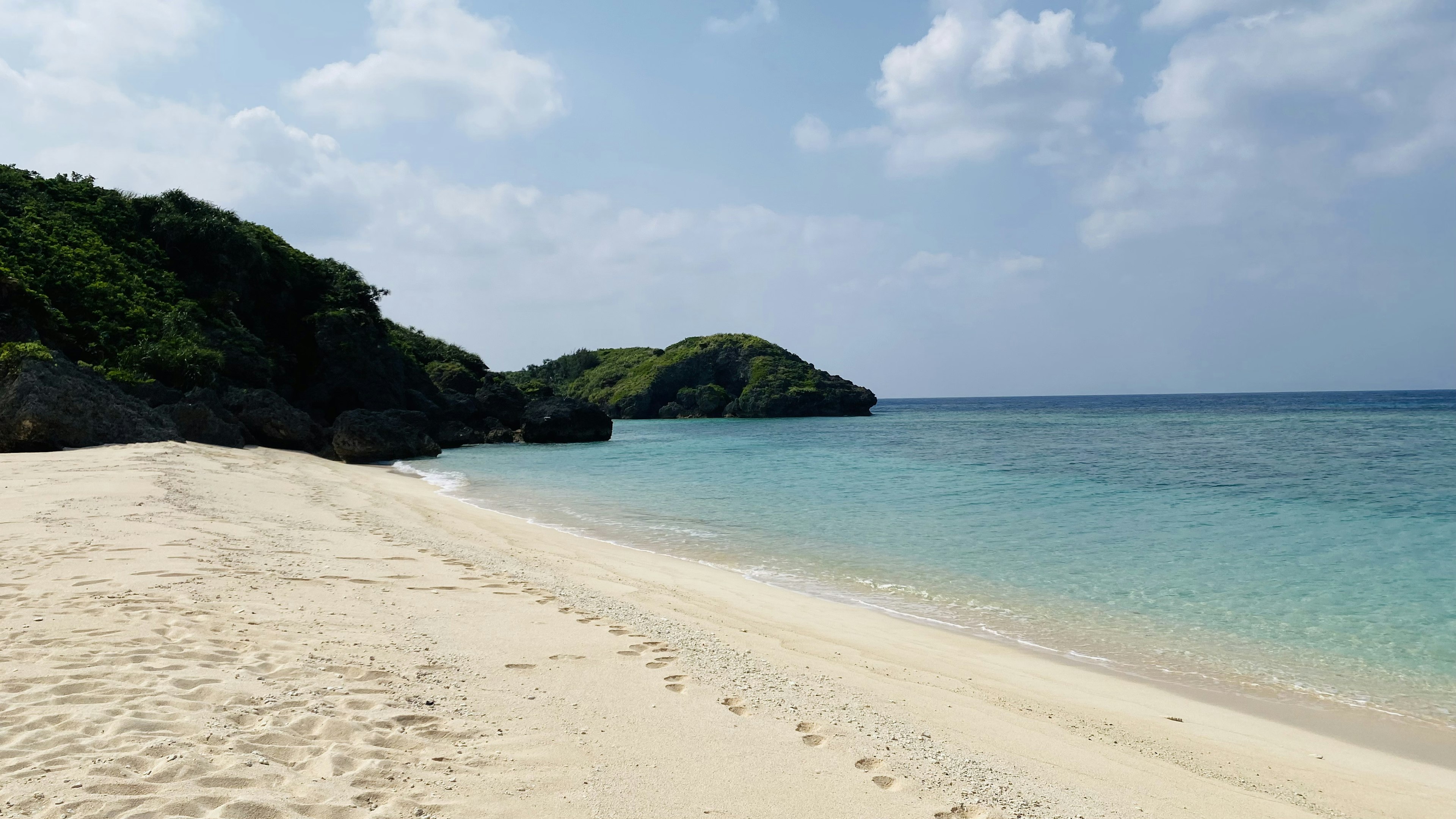 Scenic beach with white sand and clear blue water