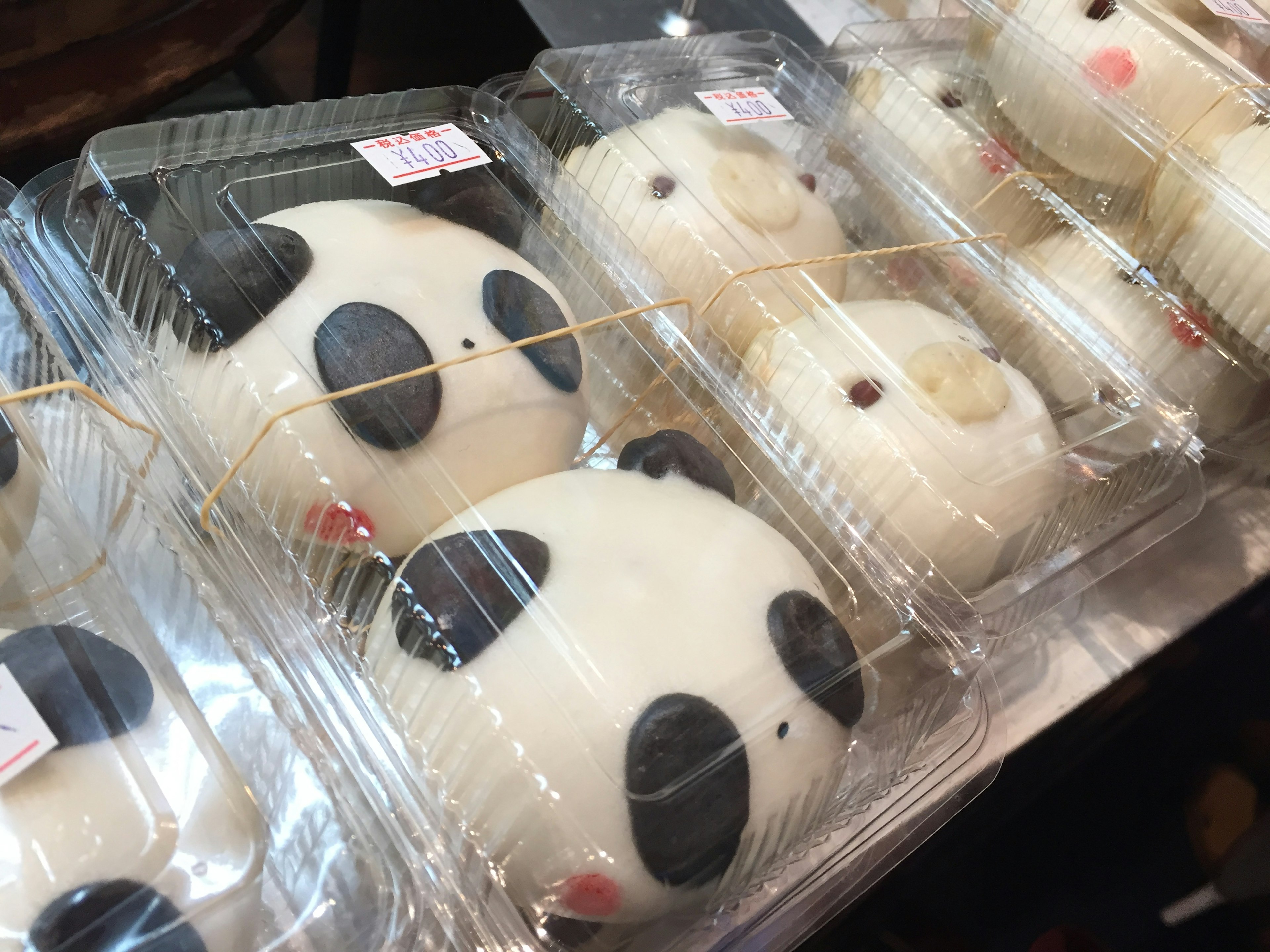 Cute panda-shaped buns displayed in clear packaging