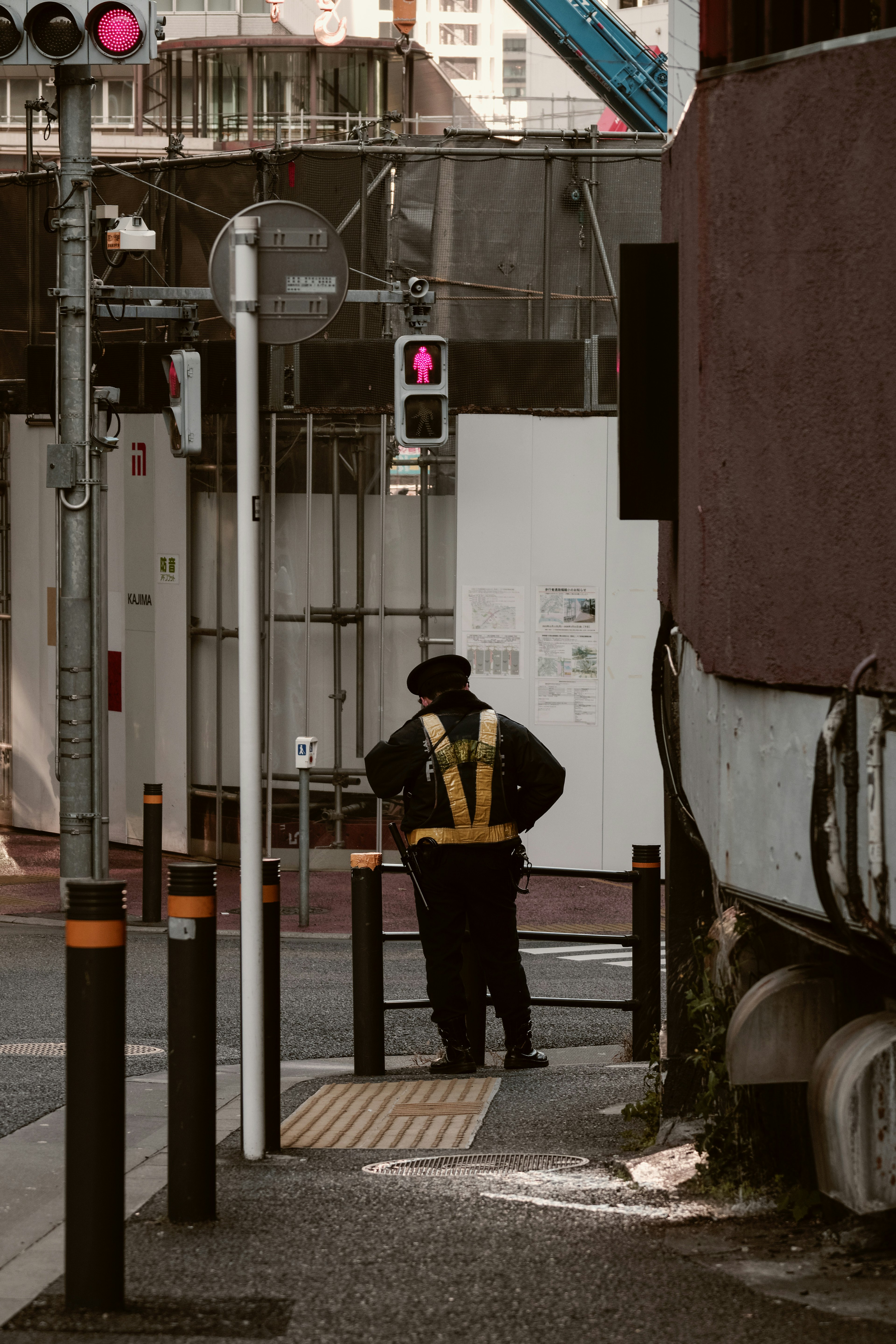 A security guard managing traffic at an intersection