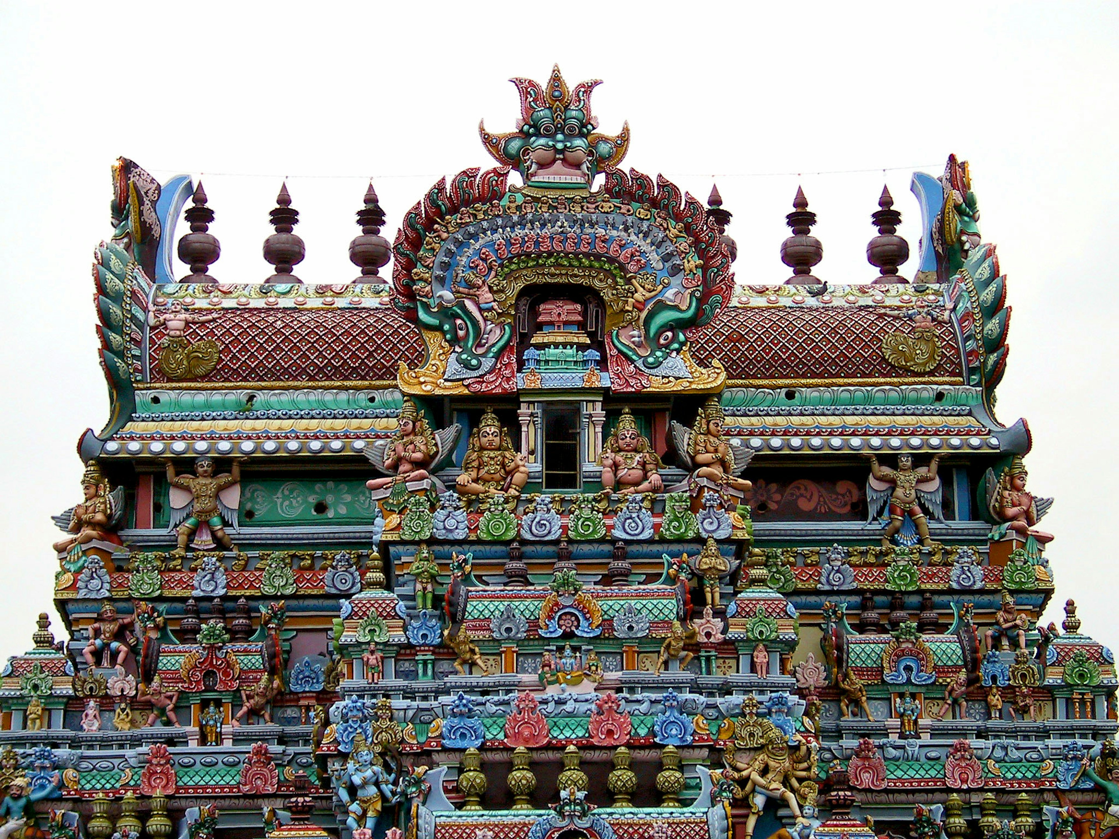 Detailed colorful sculptures and decorations of a Hindu temple tower