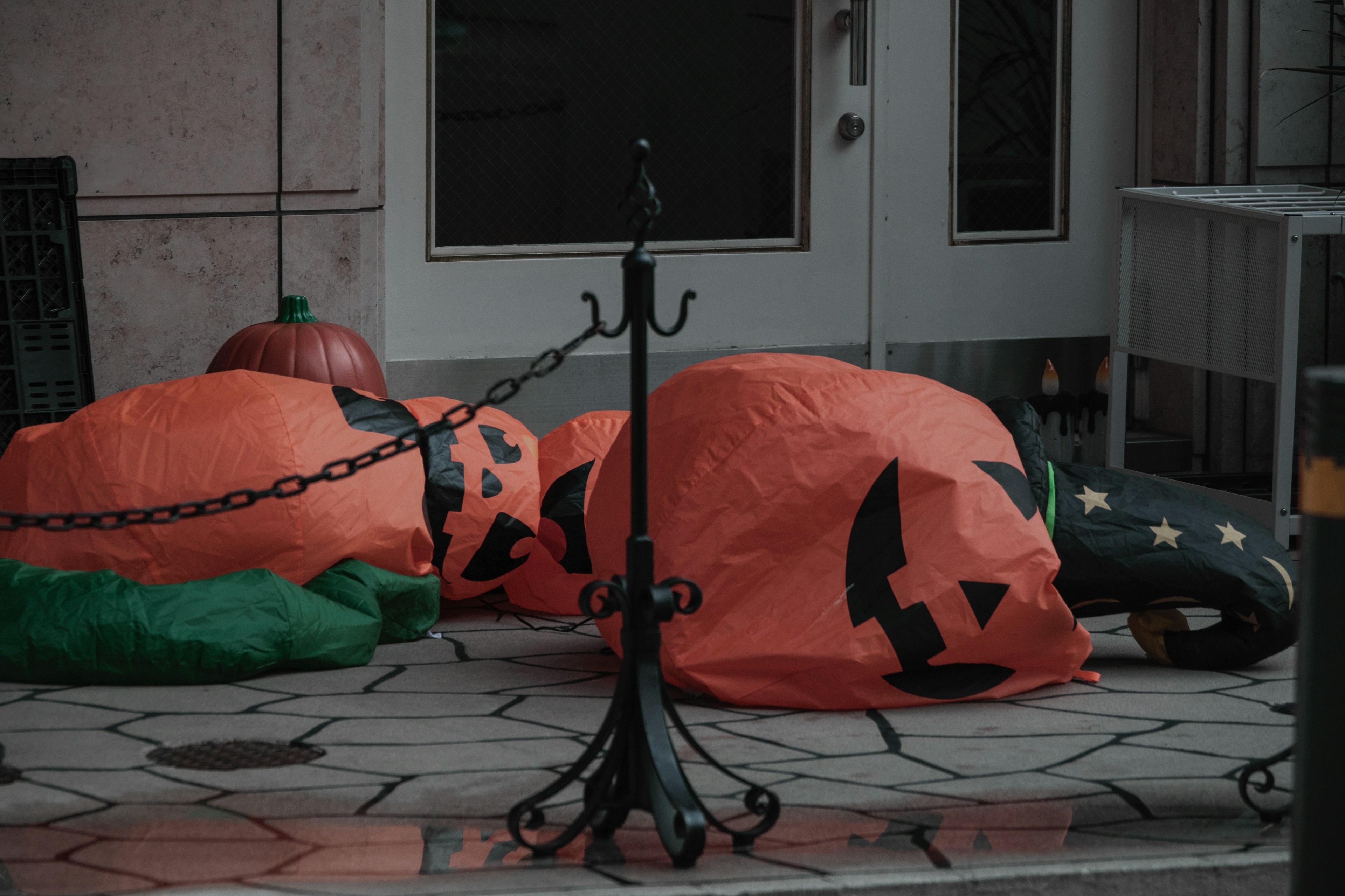 Deflated orange pumpkin decorations for Halloween on the ground