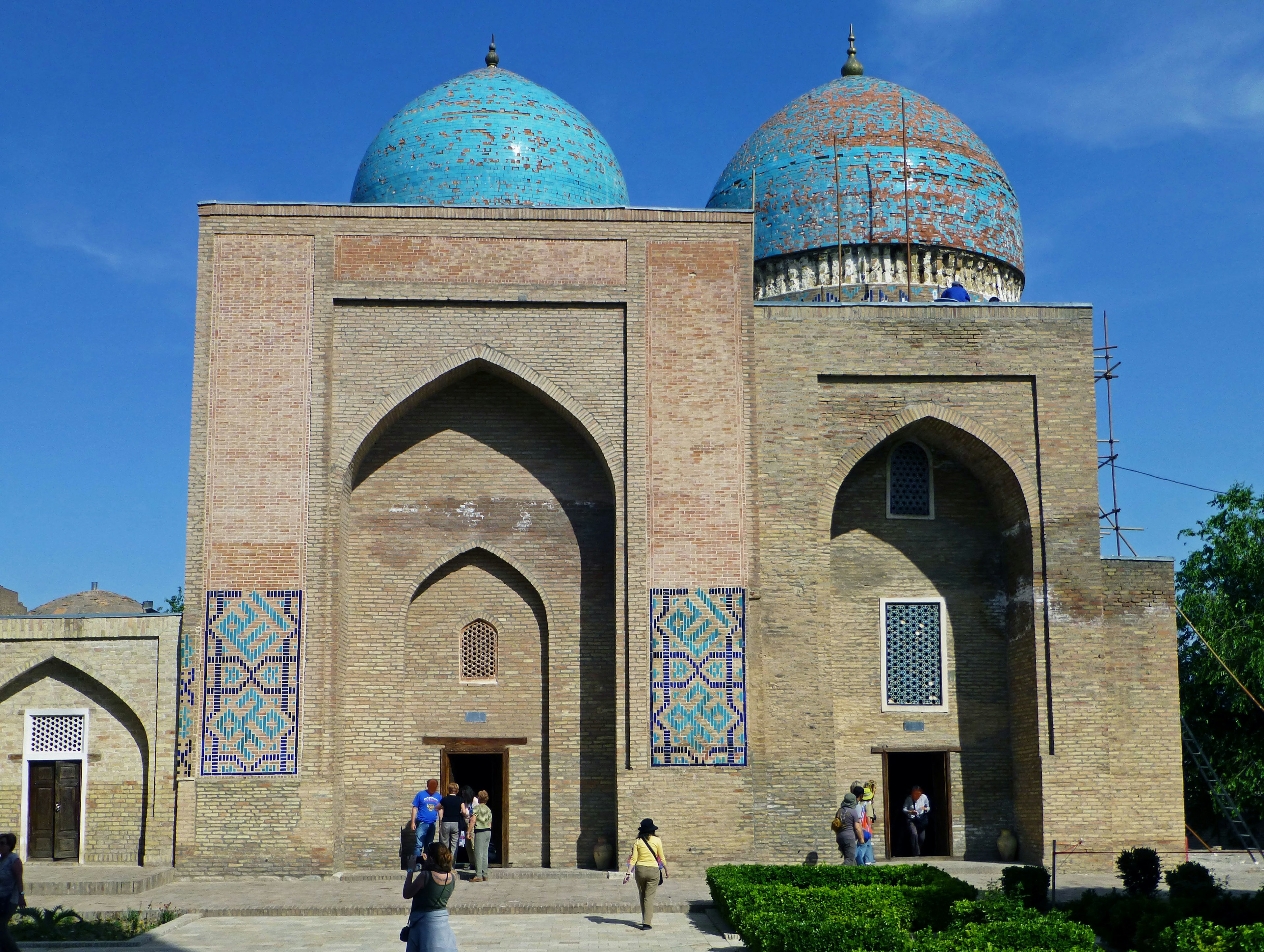 Historic building with blue domes and visitors