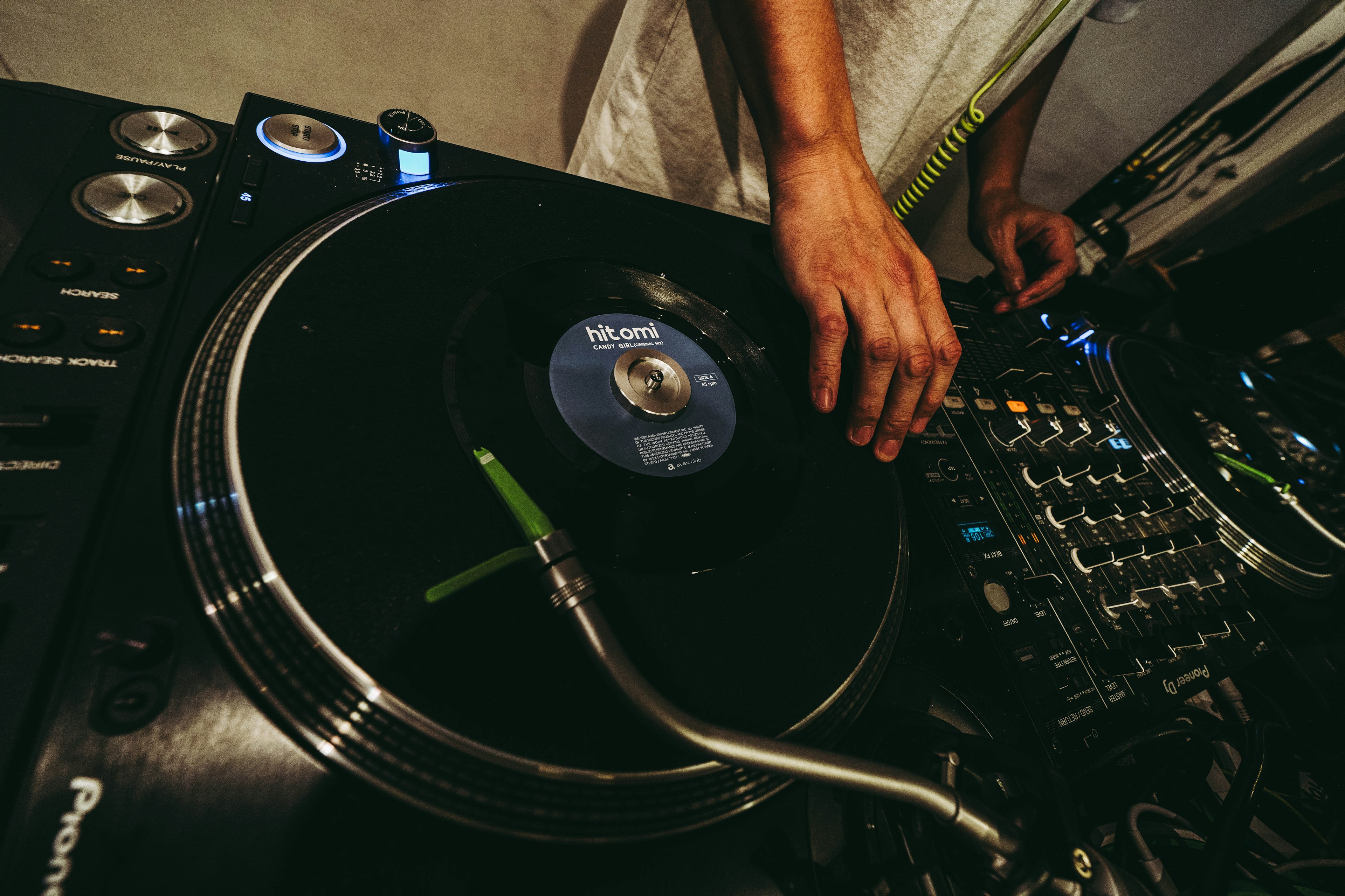 DJ using turntable to play vinyl record