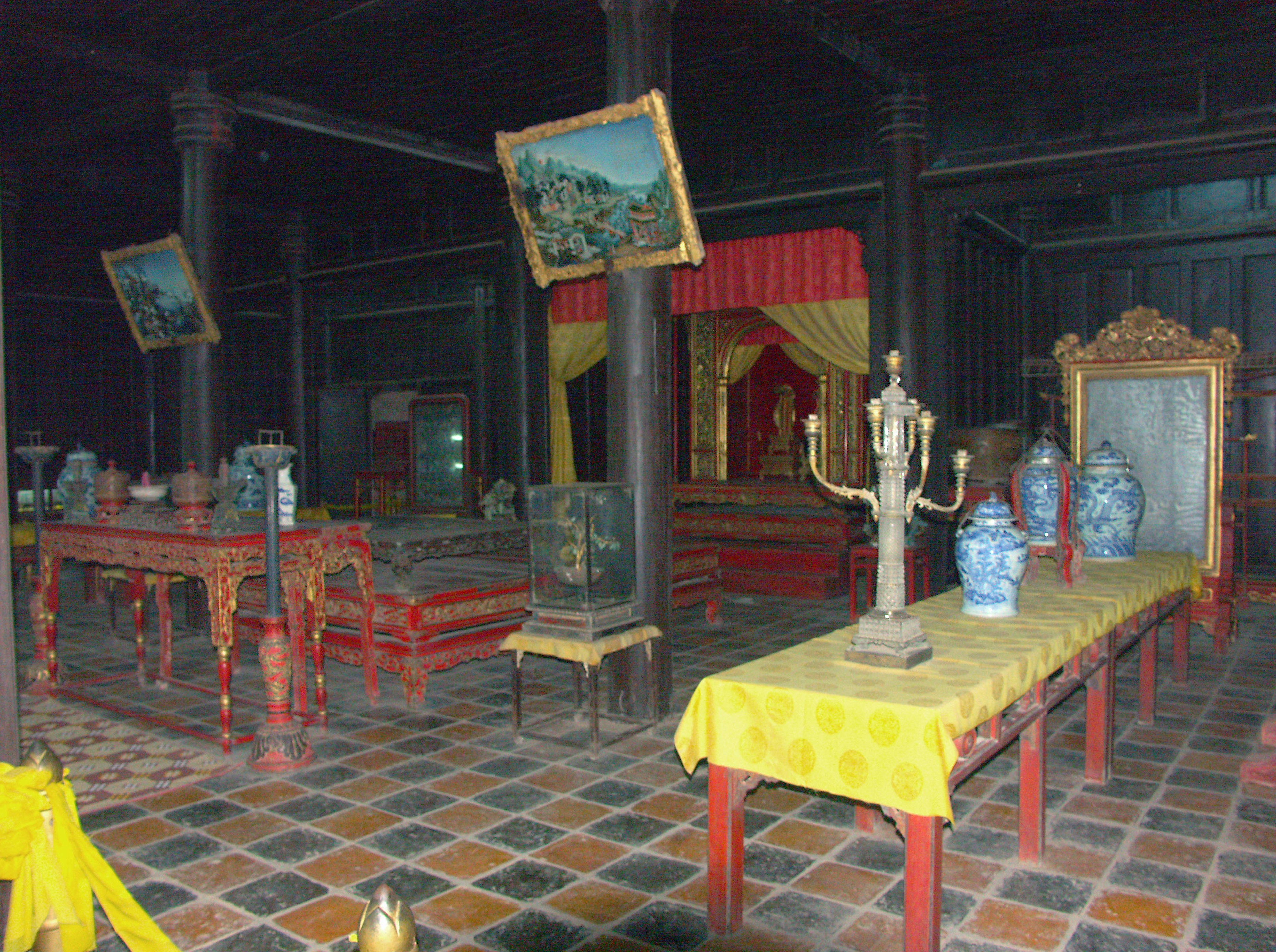 Interior of an old temple featuring decorative furniture and sculptures