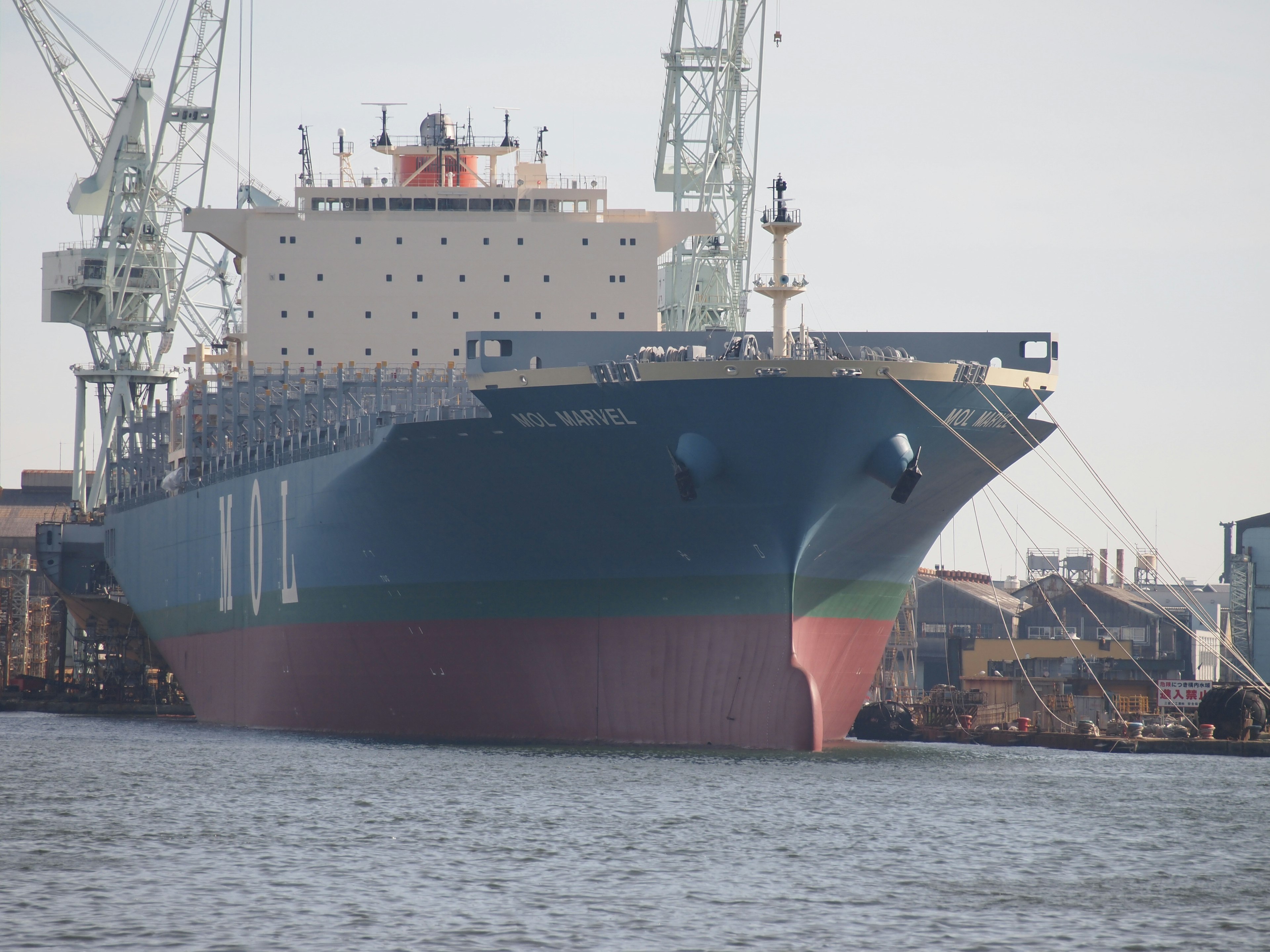 A large cargo ship docked at a port