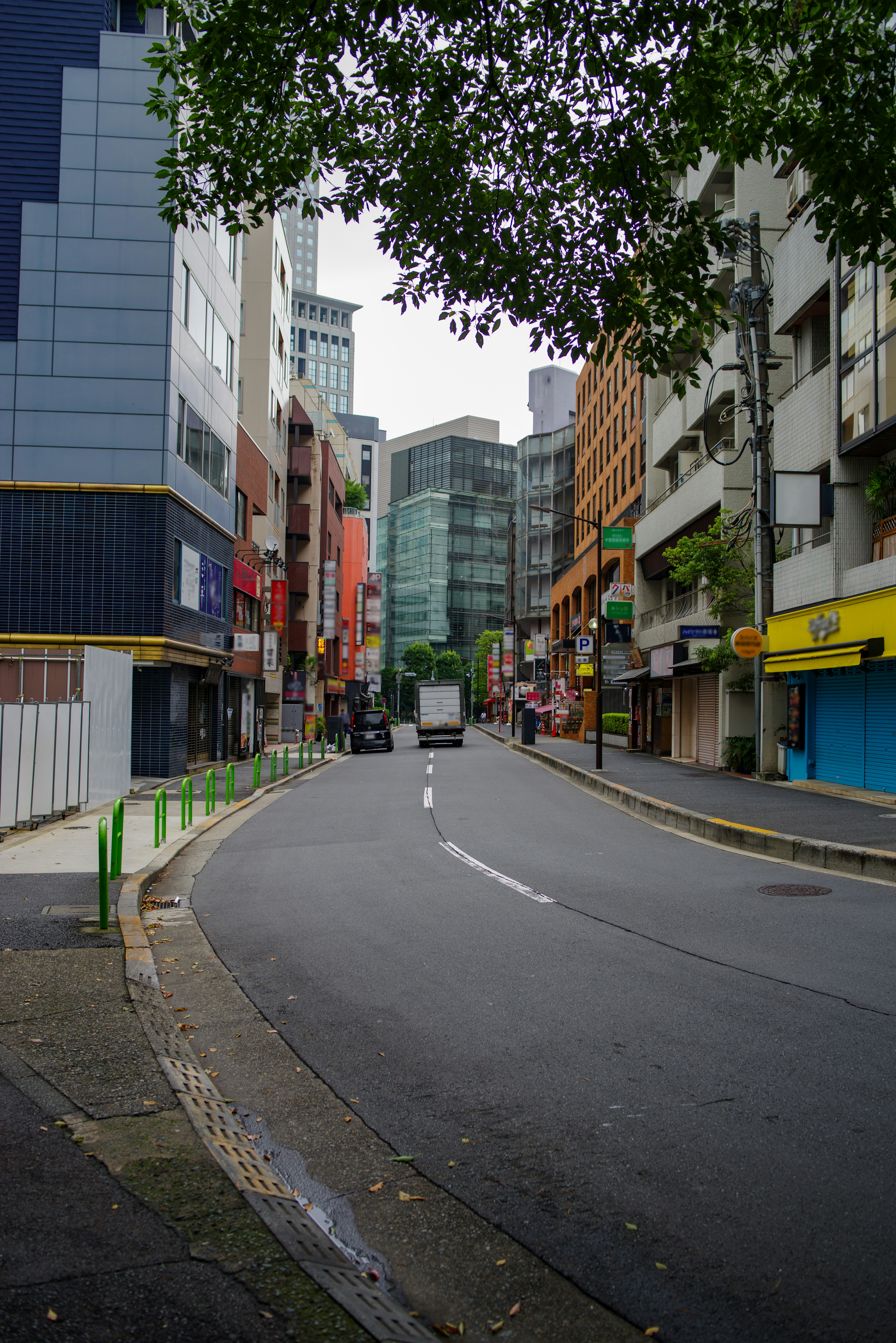 Urban street scene with modern buildings and colorful storefronts