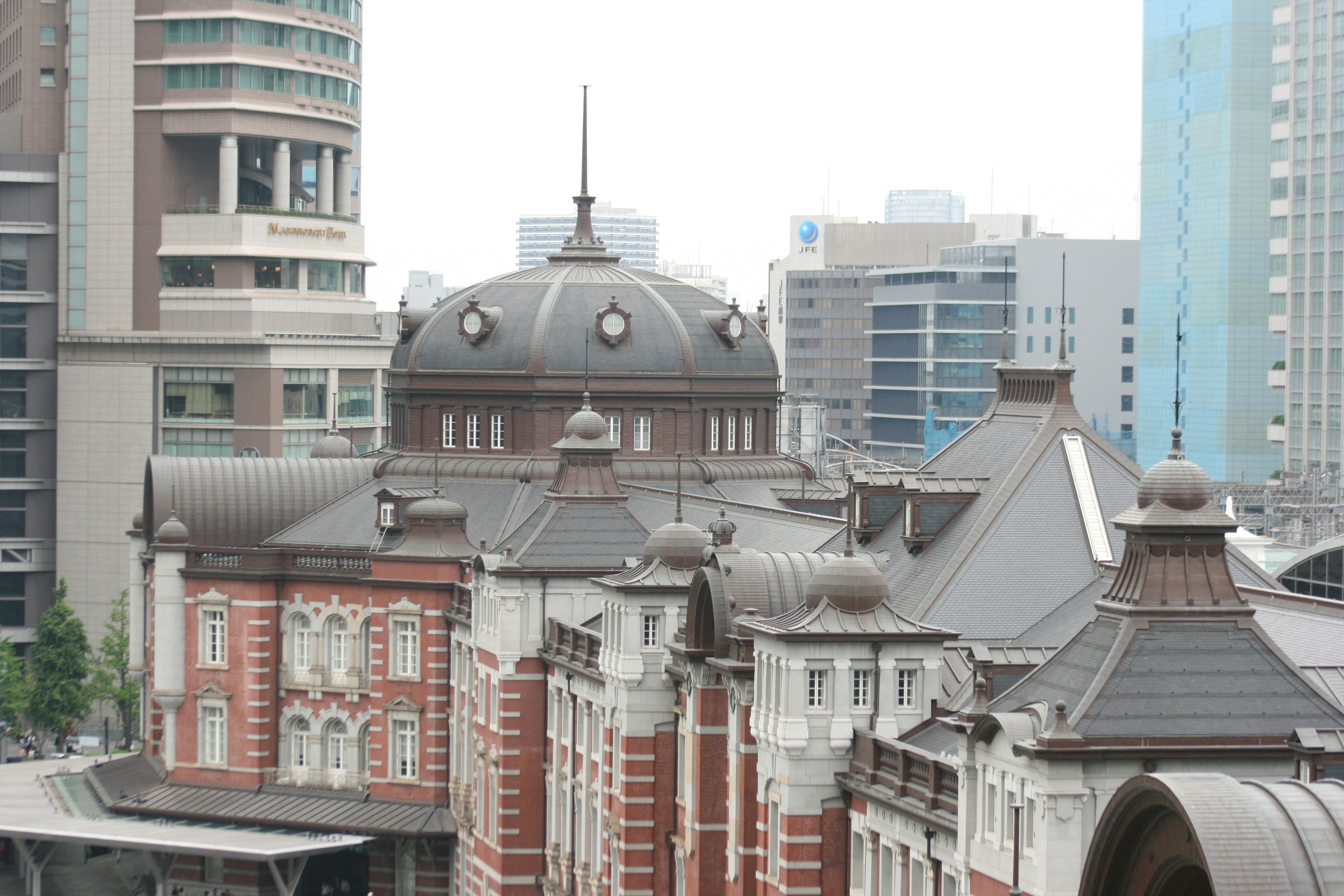 Tokyo Station with distinctive dome roof and red brick facade