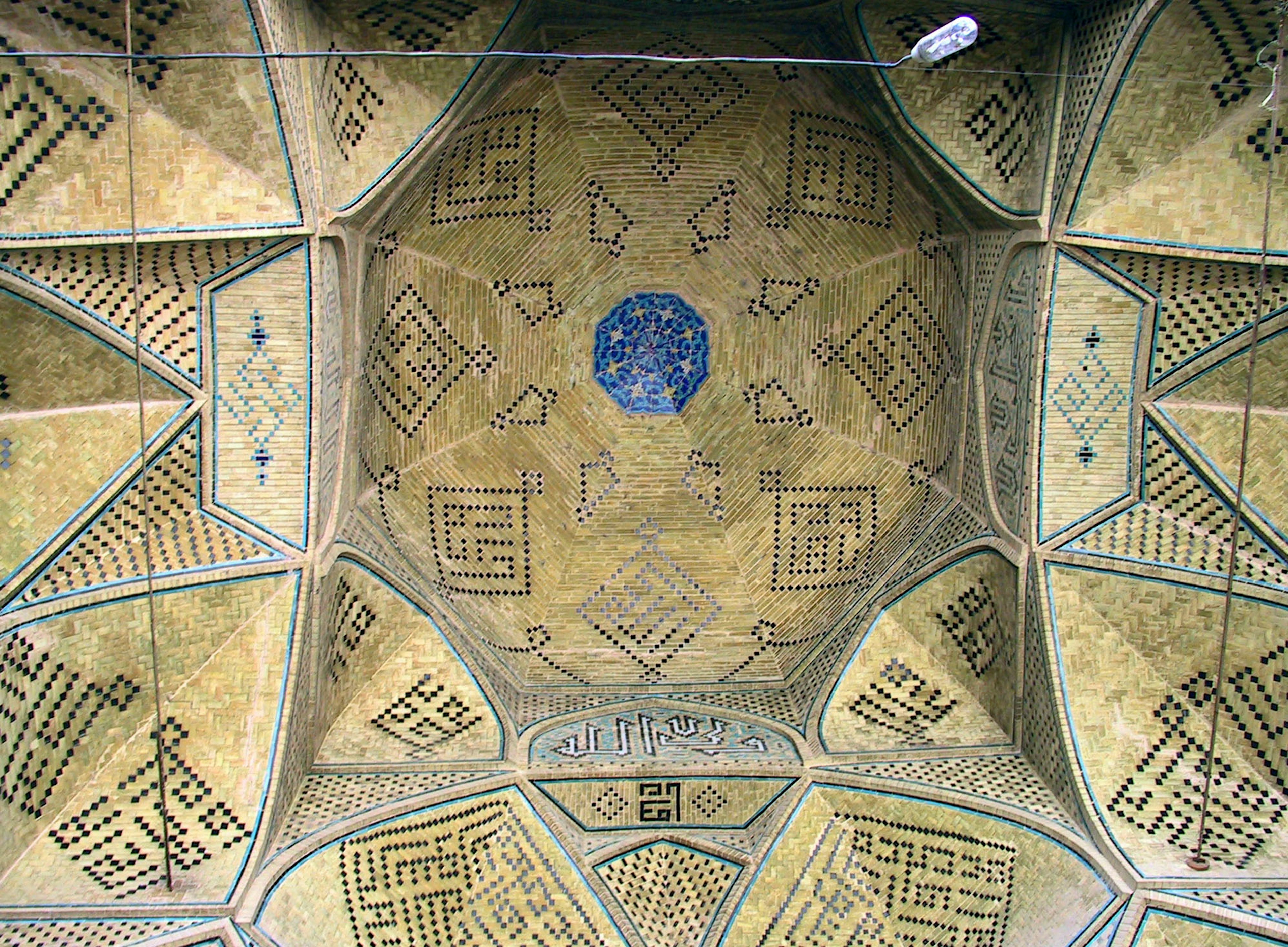 Decorative ceiling featuring geometric patterns and a blue circle