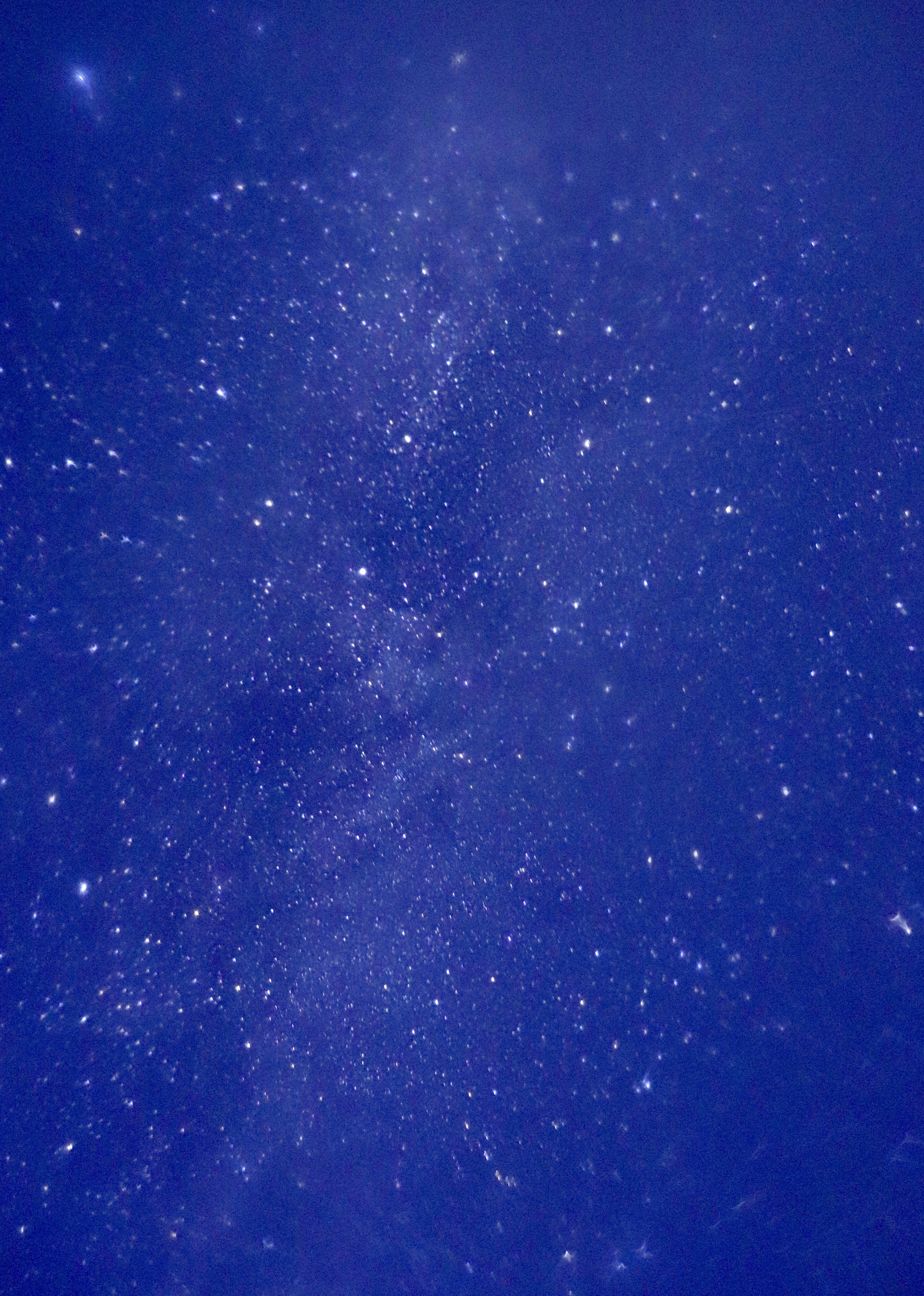 Photo of a night sky filled with countless stars against a blue background