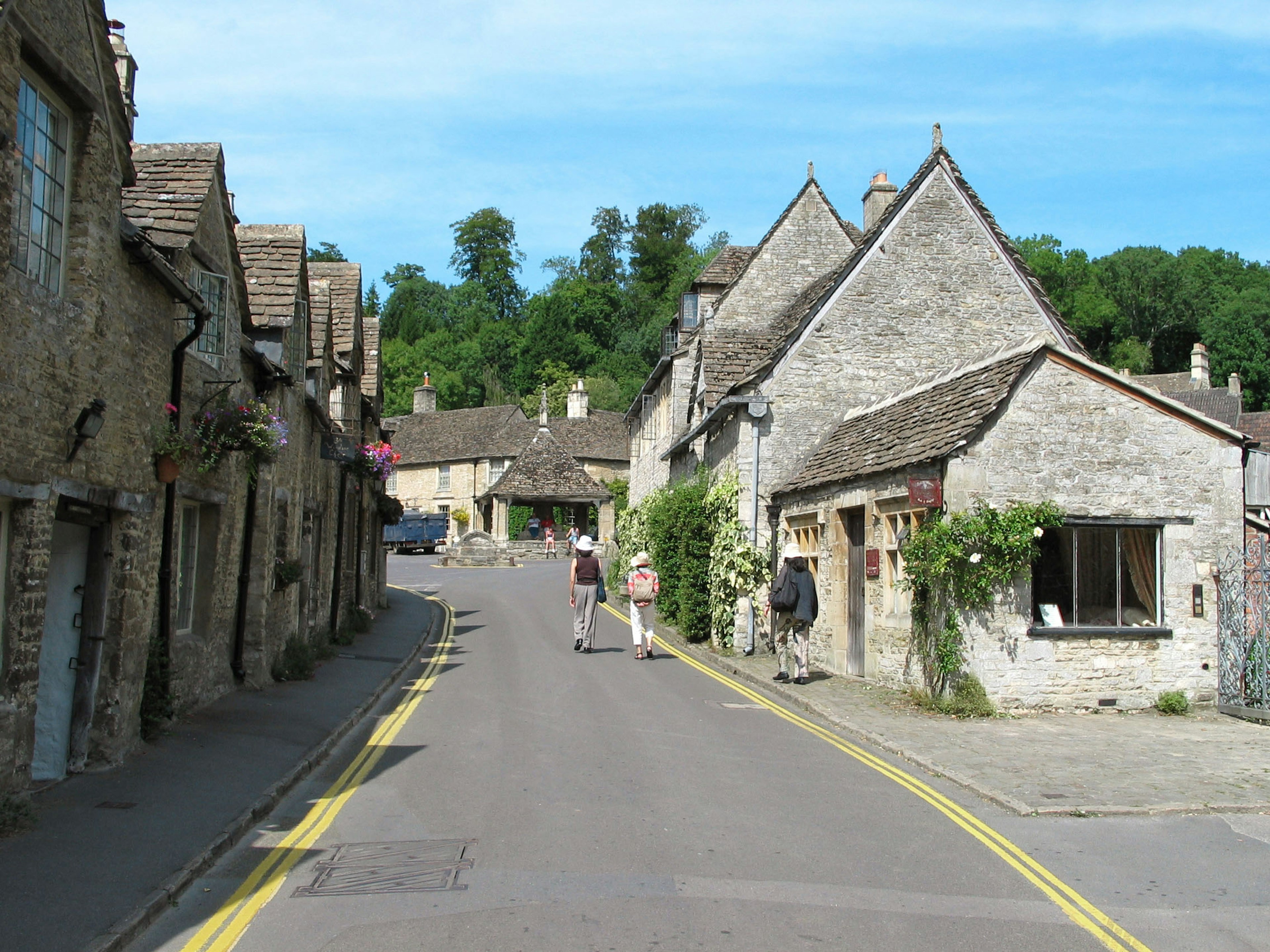 Charming village scene with stone houses and lush greenery