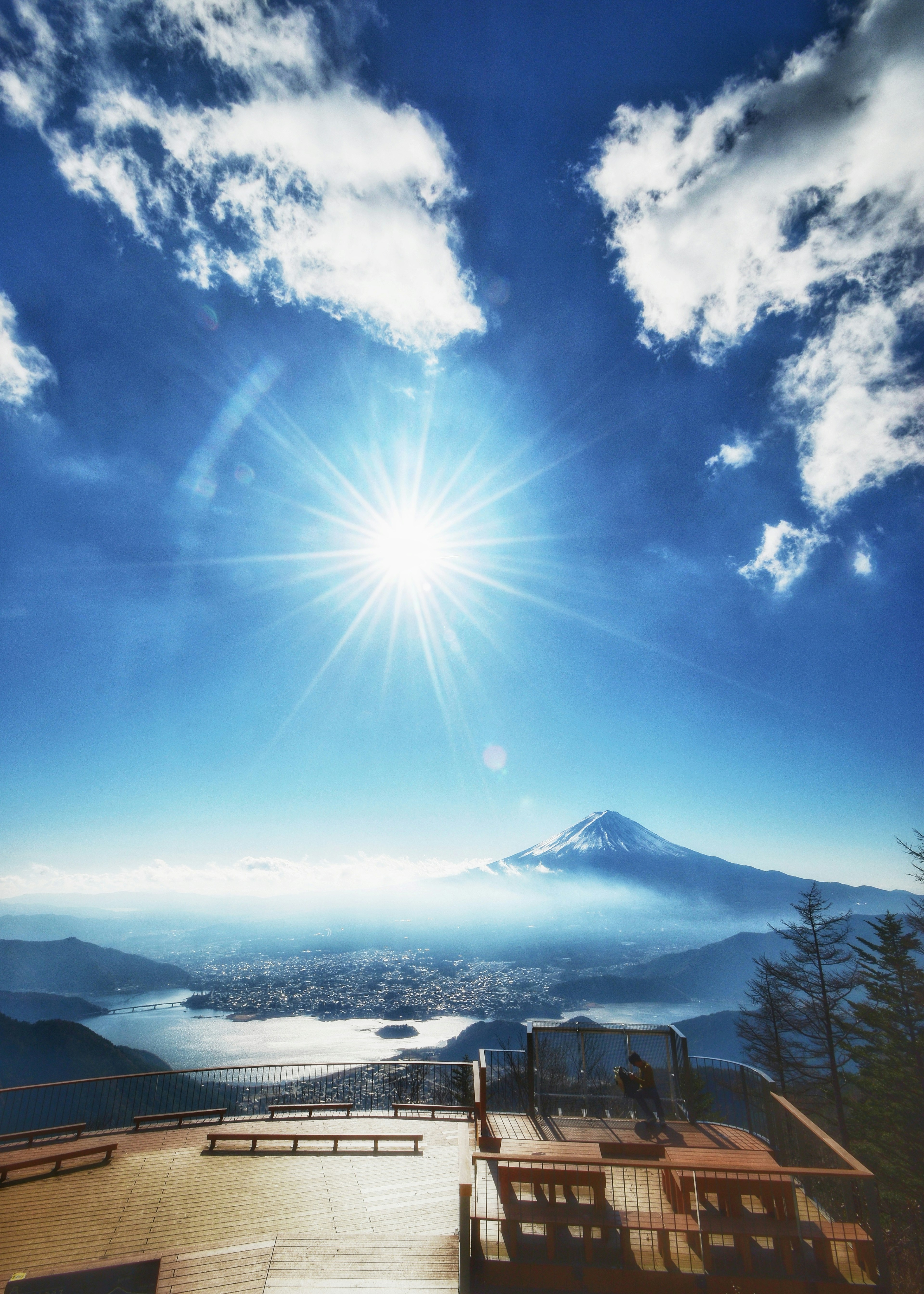 Beautiful landscape featuring Mount Fuji under a blue sky with clouds