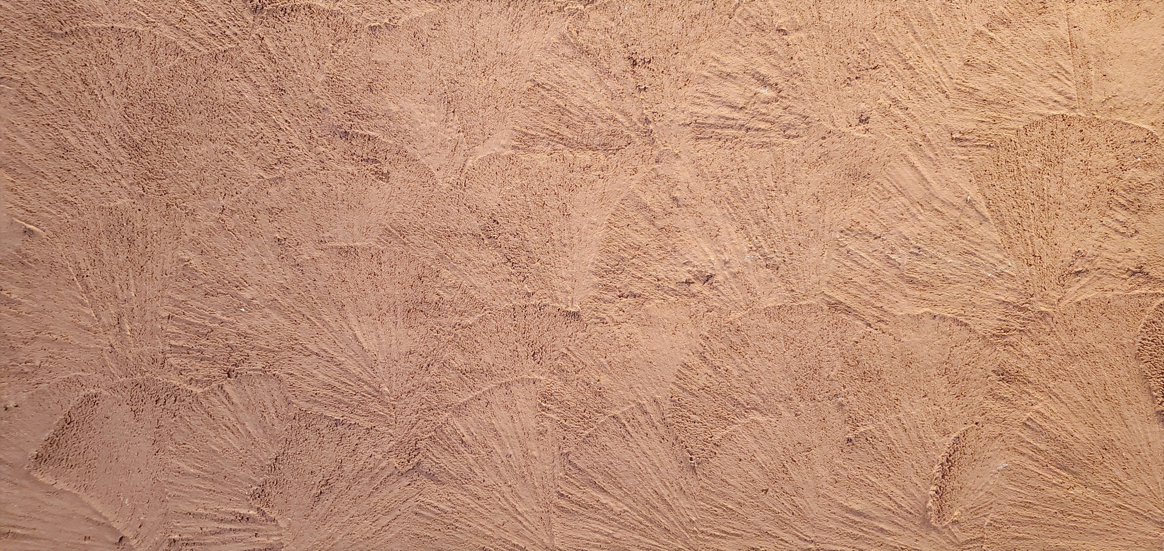 Textured light beige wall surface detail