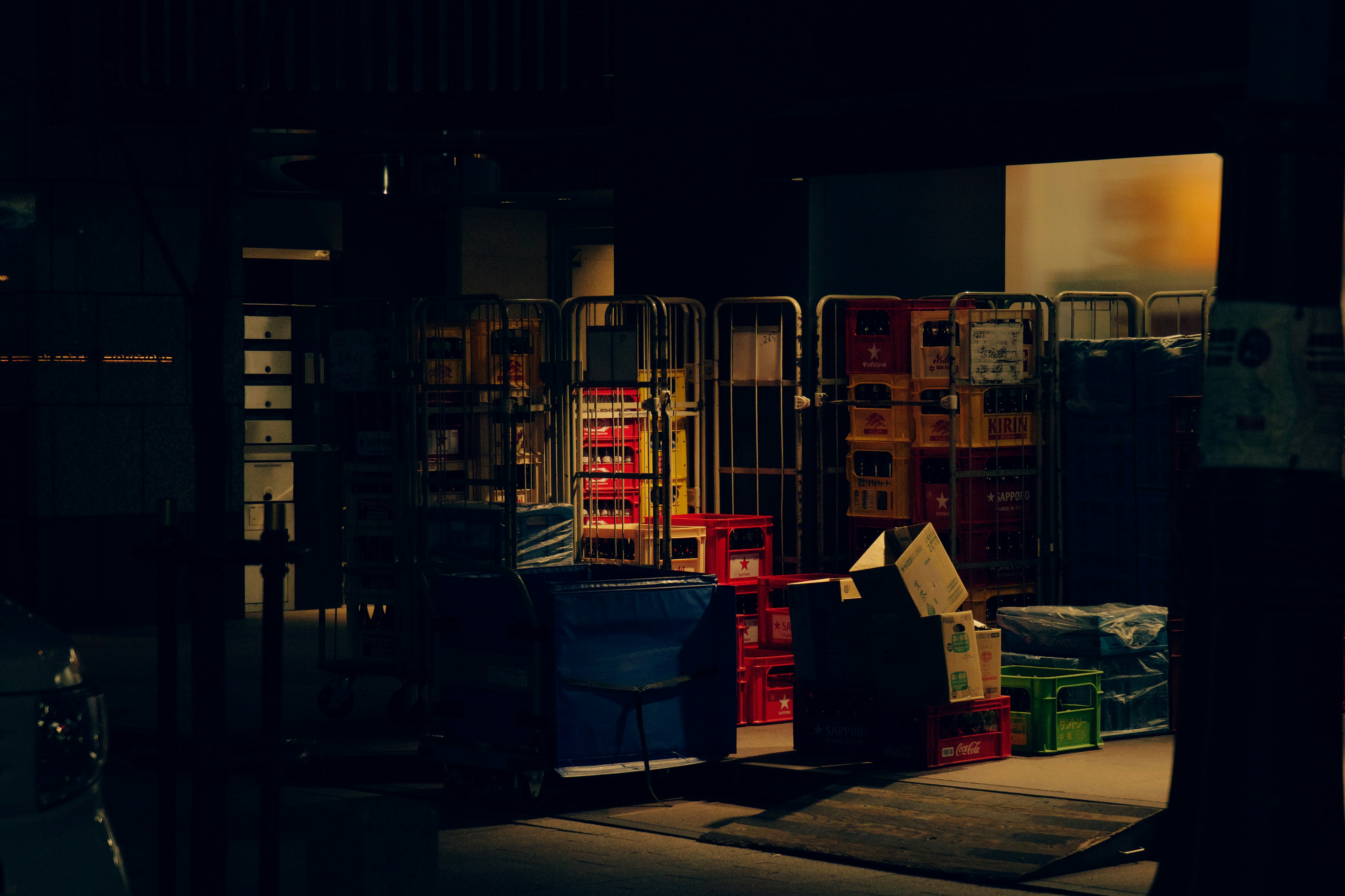 Stacks of colorful boxes and pallets in a dark background