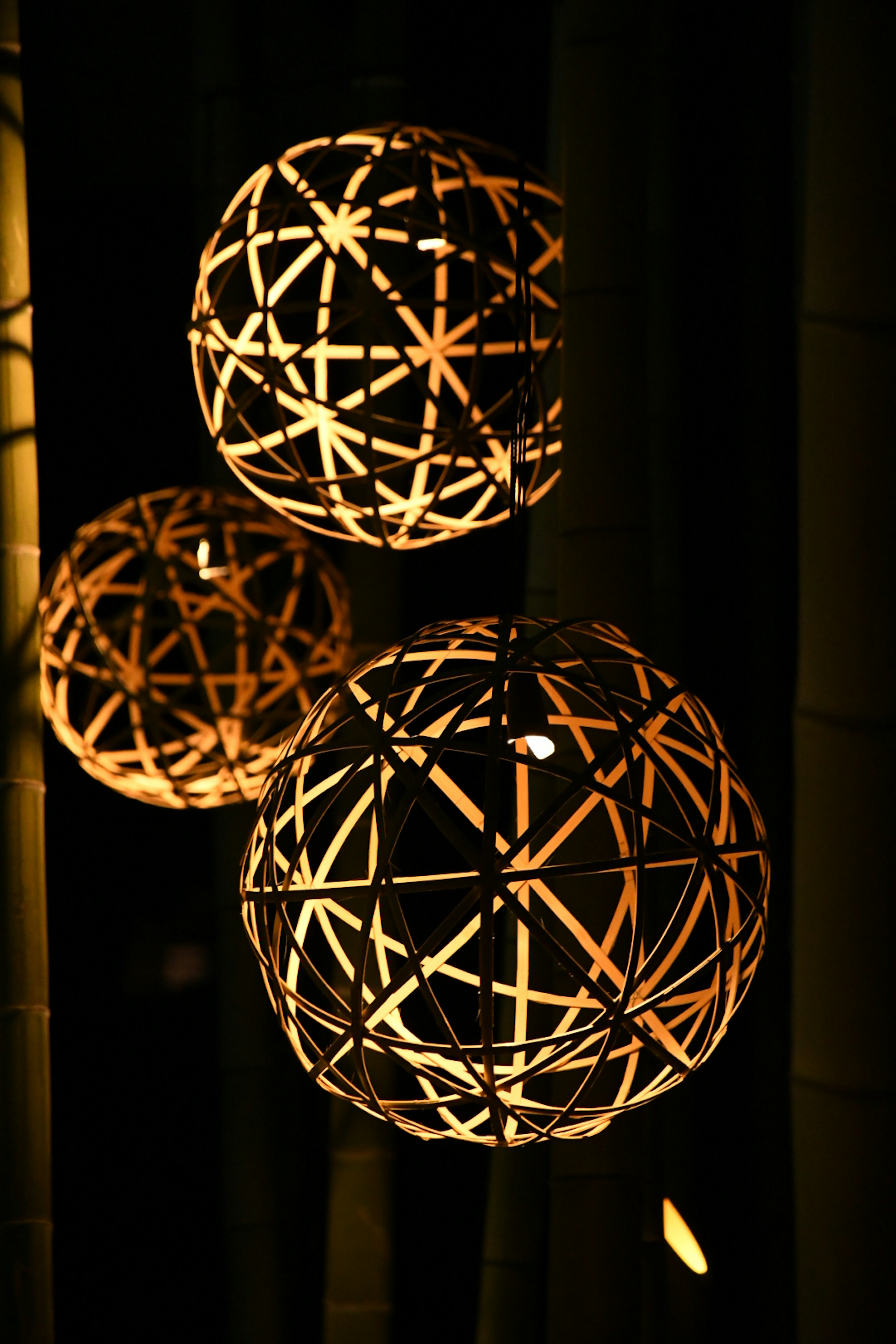 Hanging spherical lamps illuminated with warm light